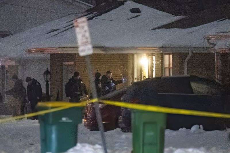 Police work a scene Monday in Joliet, Ill., after multiple people were shot and killed over two days at three locations in the Chicago suburbs.