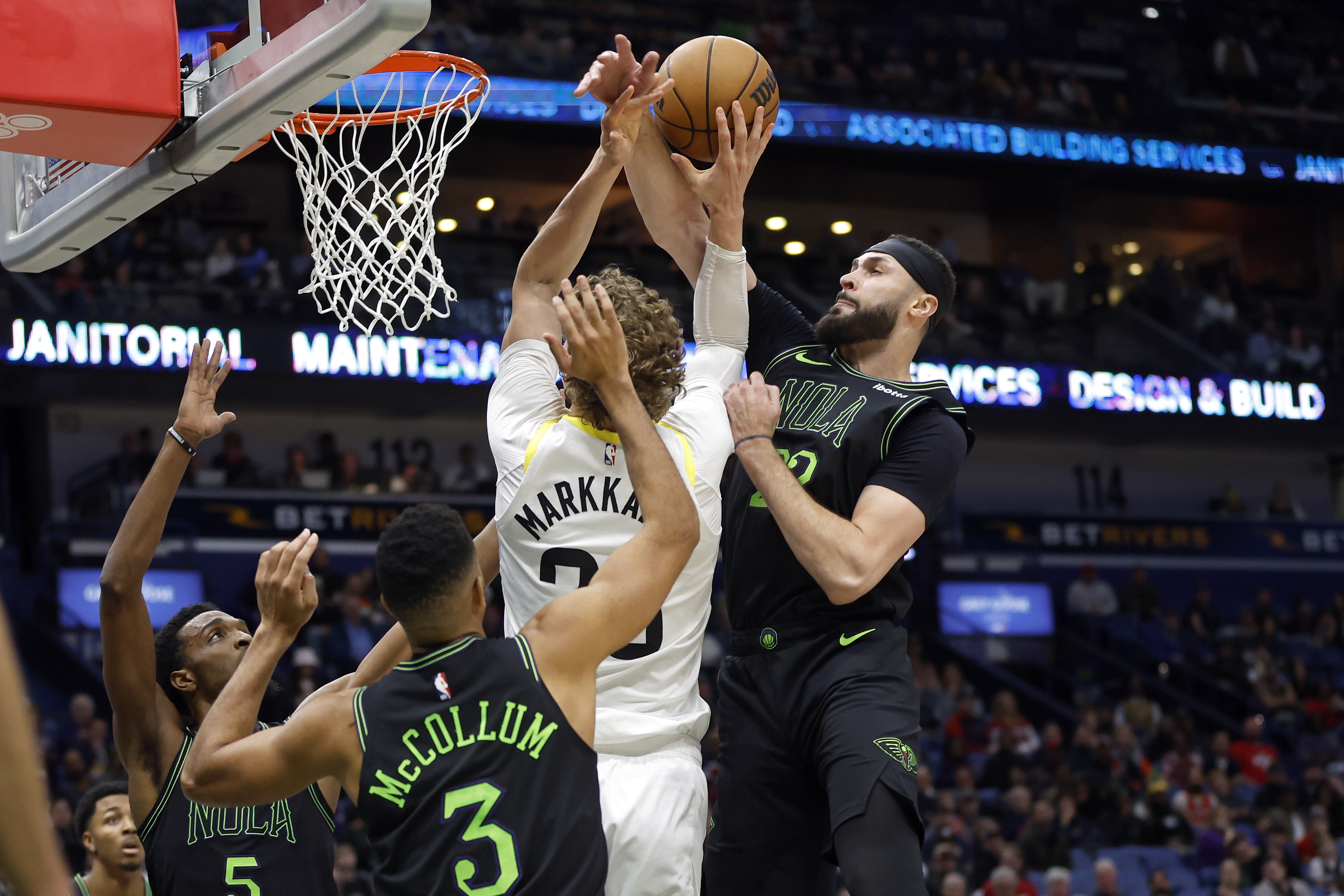 Utah Jazz forward Lauri Markkanen is fouled by New Orleans Pelicans forward Larry Nance Jr., right, during the first half of an NBA basketball game in New Orleans, Tuesday, Jan. 23, 2024. 