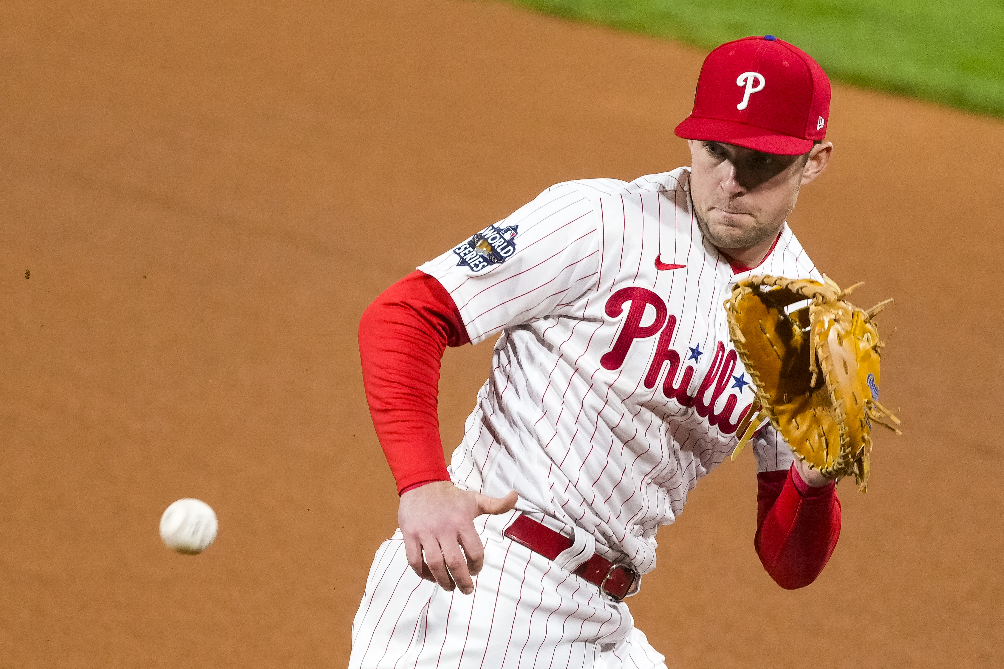 FILE - Philadelphia Phillies first baseman Rhys Hoskins fields a Houston Astros grounder during Game 3 of baseball's World Series, Nov. 1, 2022, in Philadelphia. Hoskins has agreed to a $34 million, two-year contract with Milwaukee, filling the Brewers' opening at first base. A person familiar with the deal confirmed the move to the AP on Tuesday night, Jan. 23, 2024, on condition of anonymity because it was pending a physical.