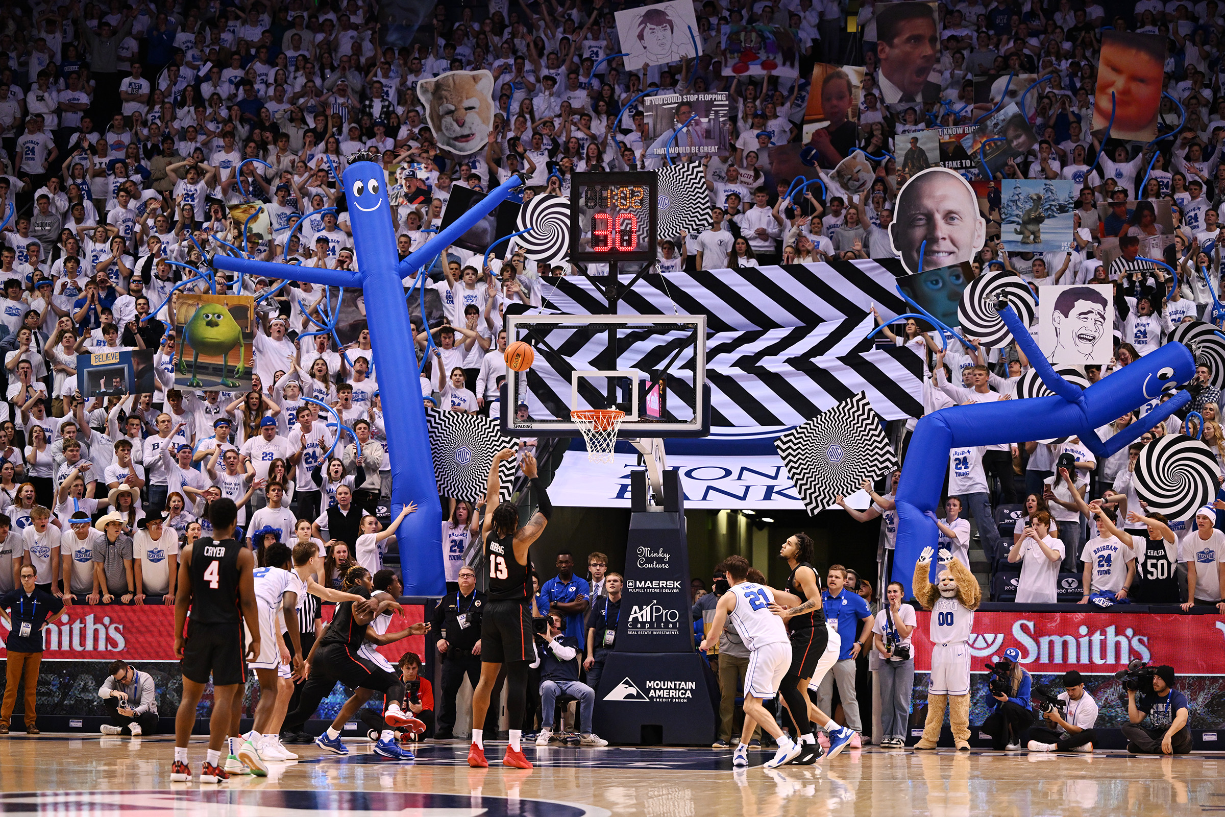Brigham Young students try to disrupt Houston Cougars forward J'Wan Roberts (13) as he shoots a free throw as BYU and Houston play at the Marriott Center in Provo on Tuesday, Jan. 23, 2024. Houston won 75-68.