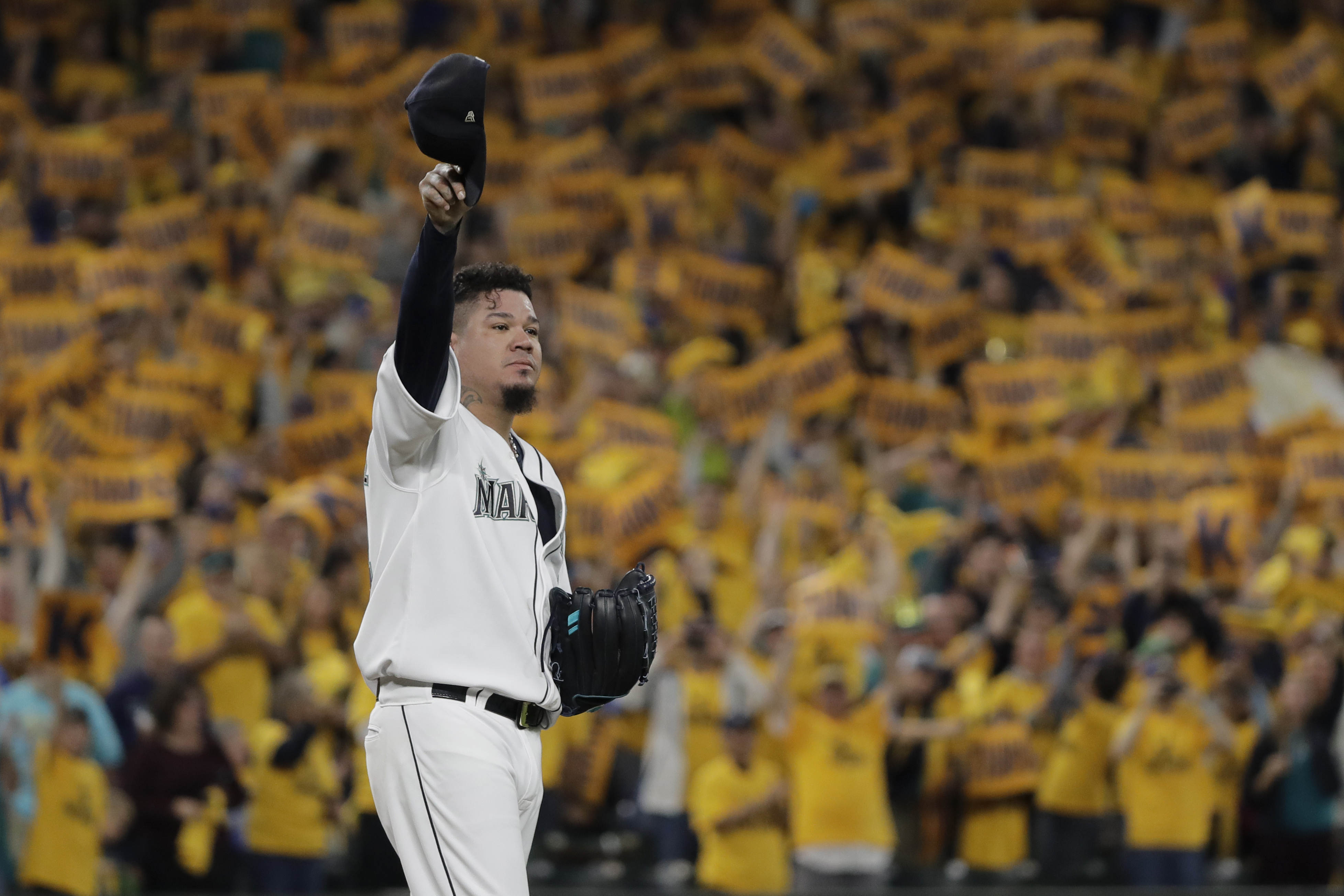 FILE - With the "King's Court" cheering section behind him, Seattle Mariners starting pitcher Félix Hernández tips his cap as he takes the mound for the team's baseball game against the Oakland Athletics, Sept. 26, 2019, in Seattle. Ichiro Suzuki headlines the group of players who are eligible for Hall of Fame voting a year from now. That ballot is also expected to include Cy Young Award winners CC Sabathia and Hernández — and the final chance for reliever Billy Wagner, who fell five votes short this time.