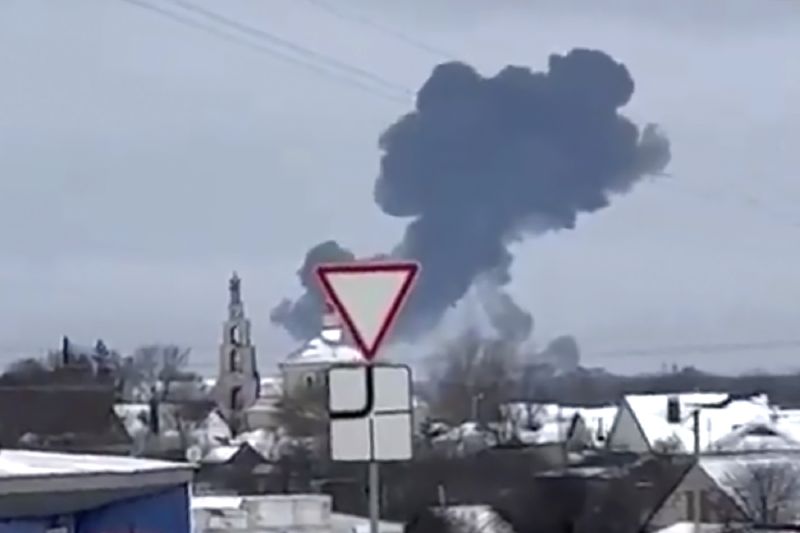 Smoke rises from the scene of a warplane crash at a residential area near Yablonovo, Belgorod region, Wednesday. Russia says a military transport plane that was carrying 65 Ukrainian prisoners of war has crashed in a Russian region near Ukraine.