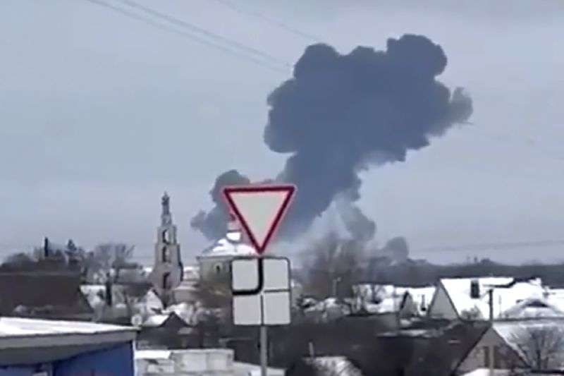 Smoke rises from the scene of a warplane crash at a residential area near Yablonovo, Belgorod region, Wednesday. Russia says a military transport plane that was carrying 65 Ukrainian prisoners of war has crashed in a Russian region near Ukraine.