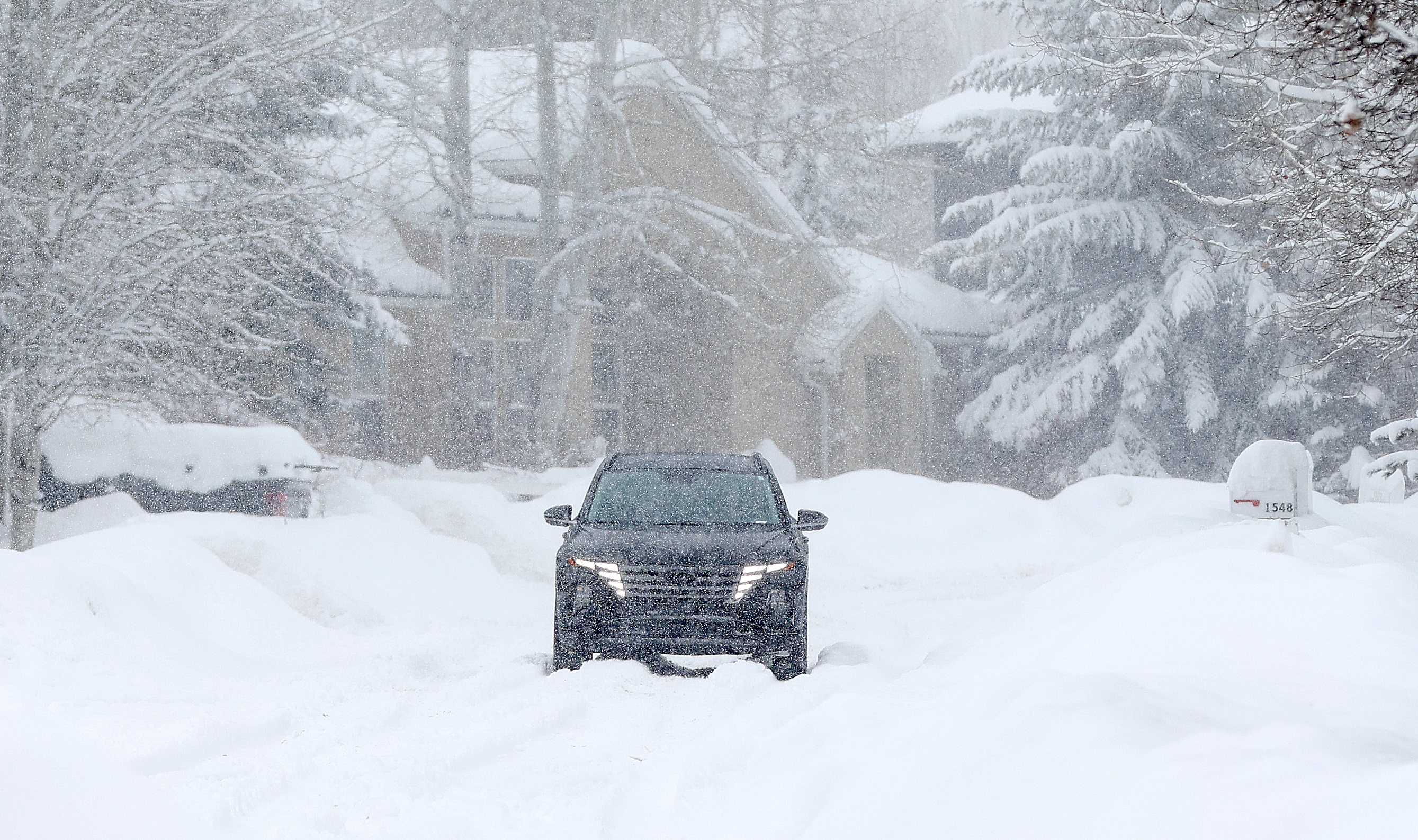 A driver in a snowstorm in Park City on Jan. 17. Snow is back in Utah's forecast on Thursday, which may cause some impacts again.