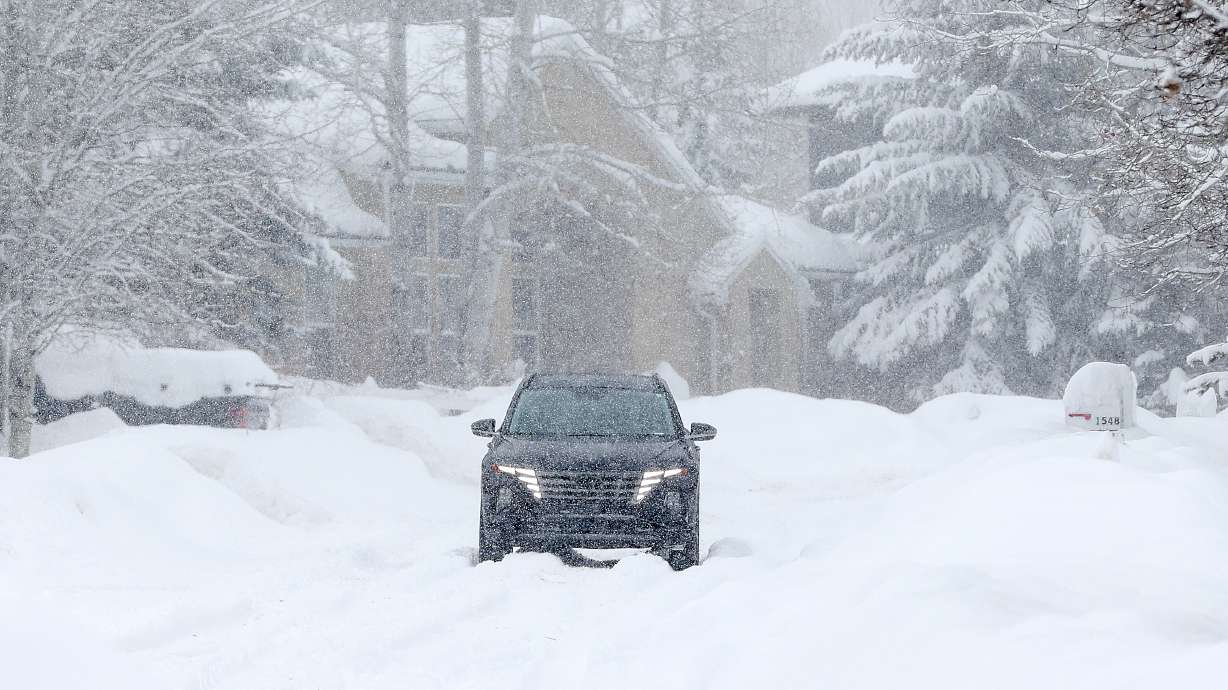 A driver in a snowstorm in Park City on Jan. 17. Snow is back in Utah's forecast on Thursday, which may cause some impacts again.