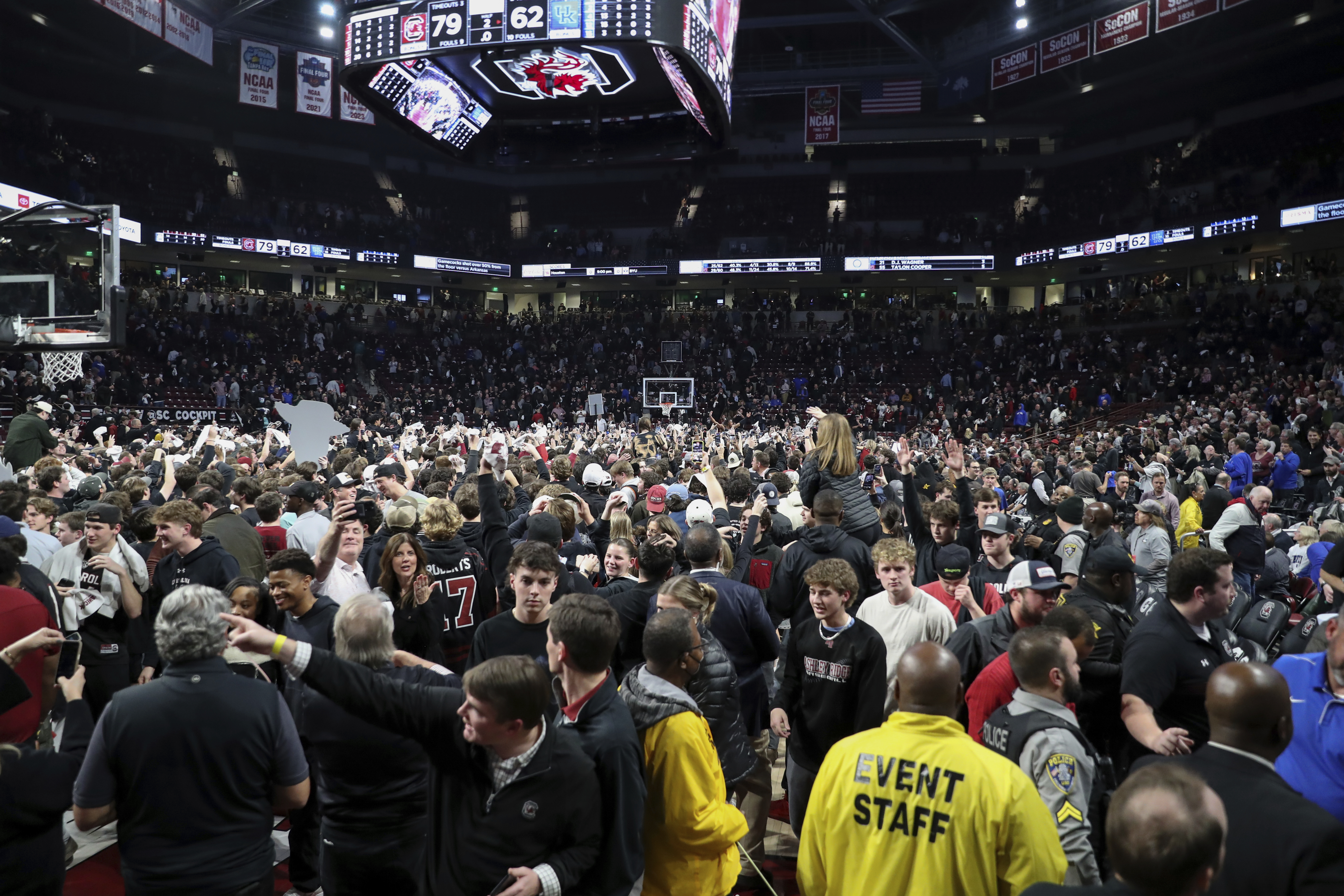 South Carolina fans take over the court after South Carolina upset Kentucky during an NCAA college basketball game Tuesday, Jan. 23, 2024, in Columbia, S.C. South Carolina won 79-62.