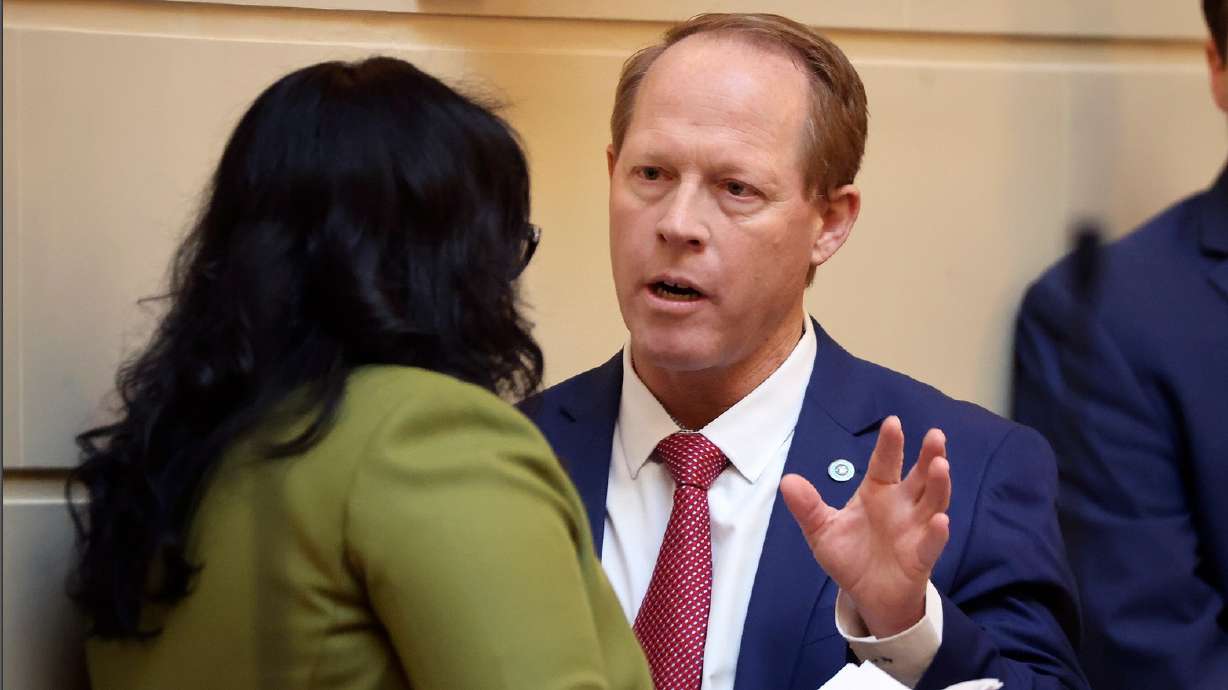 Senate Minority Leader Luz Escamilla, D-Salt Lake City, talks to Sen. Keith Grover, R-Provo, shortly before Grover presents HB261 Equal Opportunity Initiatives in the Senate chamber at the Capitol in Salt Lake City on Wednesday.