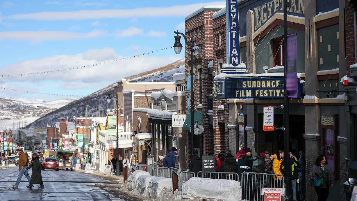 People gather outside of the Egyptian Theatre during the 2024 Sundance Film Festival on Main Street in Park City on Jan. 18. The festival is celebrating its 40th season this year.