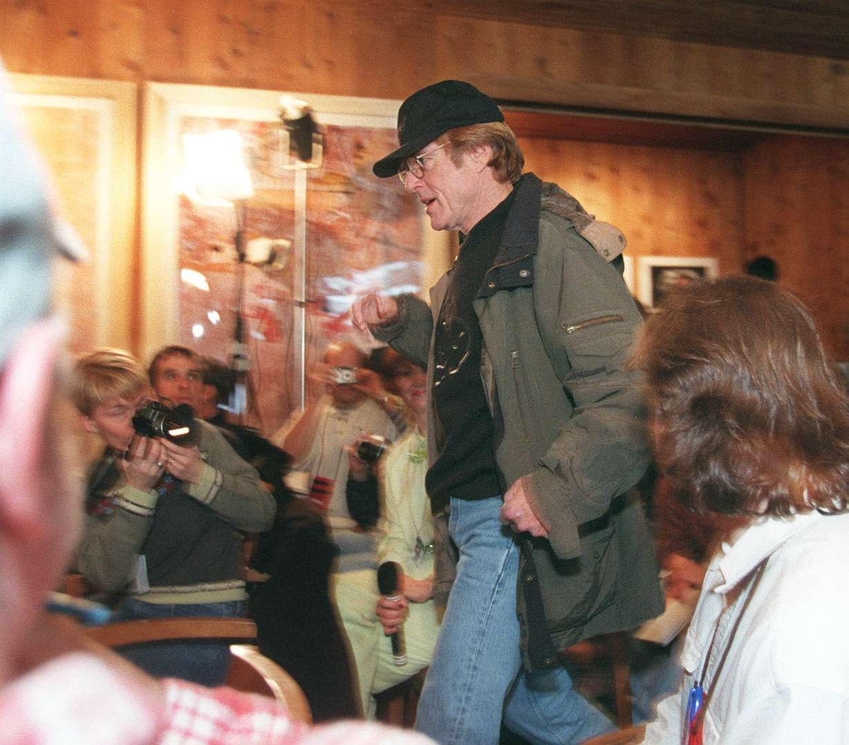 Robert Redford enters his Sundance Film Festival Press conference on Jan. 17, 1998.