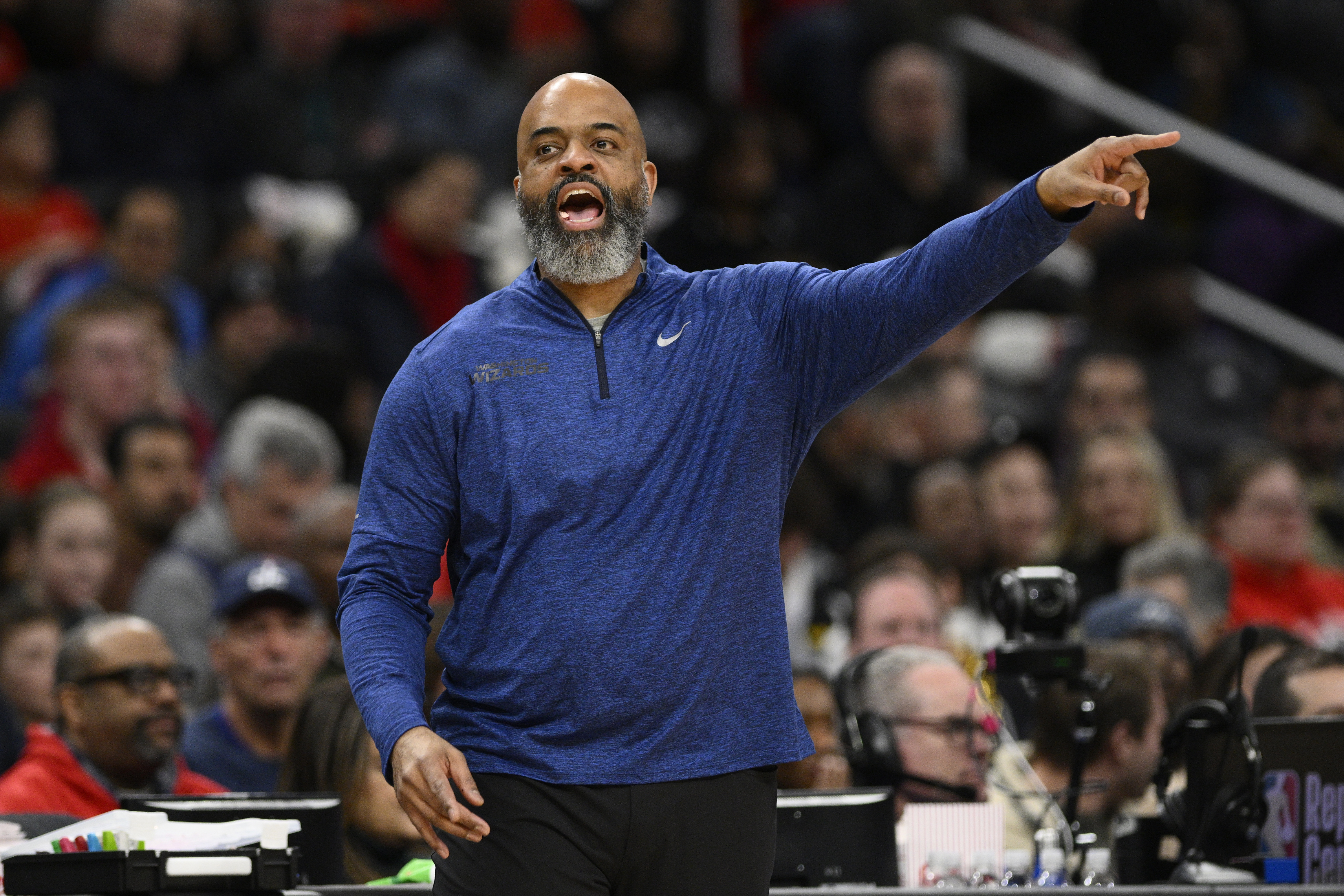 Washington Wizards head coach Wes Unseld Jr. gestures during the first half of an NBA basketball game against the Denver Nuggets, Sunday, Jan. 21, 2024, in Washington. 