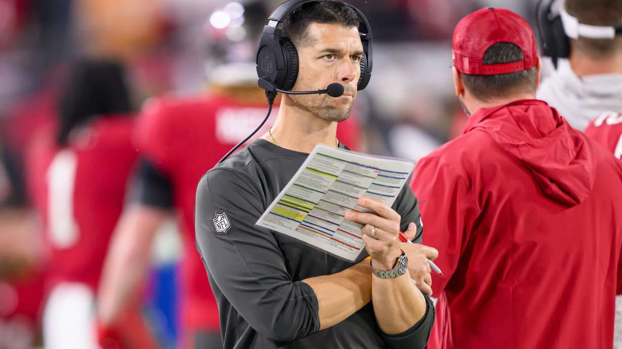 FILE - Tampa Bay Buccaneers offensive coordinator Dave Canales holds the play sheet on the sidelines during an NFL wild-card playoff football game against the Philadelphia Eagles, Monday, Jan. 15, 2024 in Tampa, Fla. The Carolina Panthers have agreed to hire Tampa Bay Buccaneers offensive coordinator Dave Canales as their new head coach, according to two people familiar with the situation.