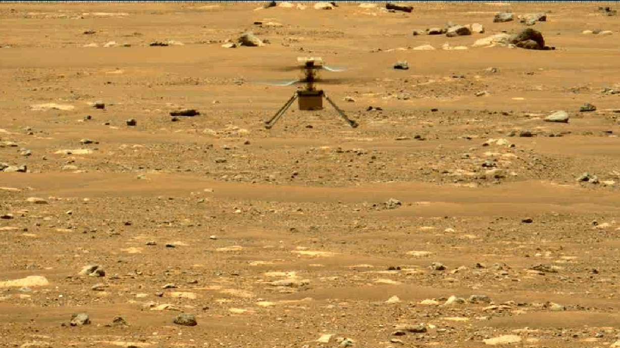 The Mars Ingenuity helicopter hovers above the surface of the planet during its second flight on April 22, 2021. On Thursday, NASA announced that the 4-pound chopper can no longer fly.