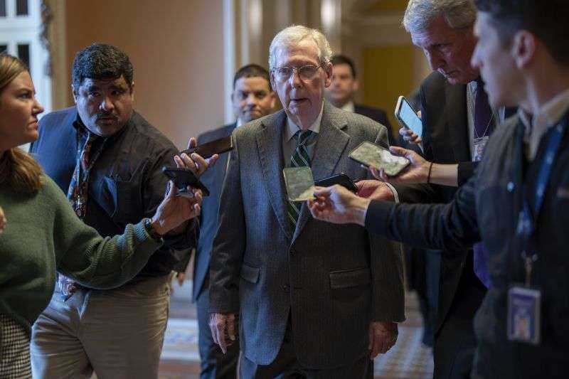 Senate Minority Leader Mitch McConnell, R-Ky., walks to the chamber at the Capitol in Washington, Thursday with bipartisan negotiations on border security unresolved.