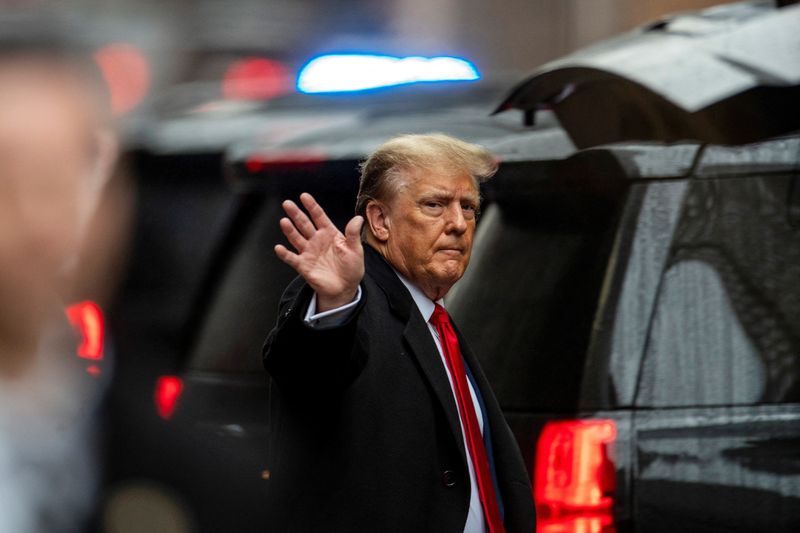 Former President Donald Trump gestures to his supporters, as he departs for his second civil trial after E. Jean Carroll accused Trump of raping her decades ago, outside a Trump Tower in New York Friday.