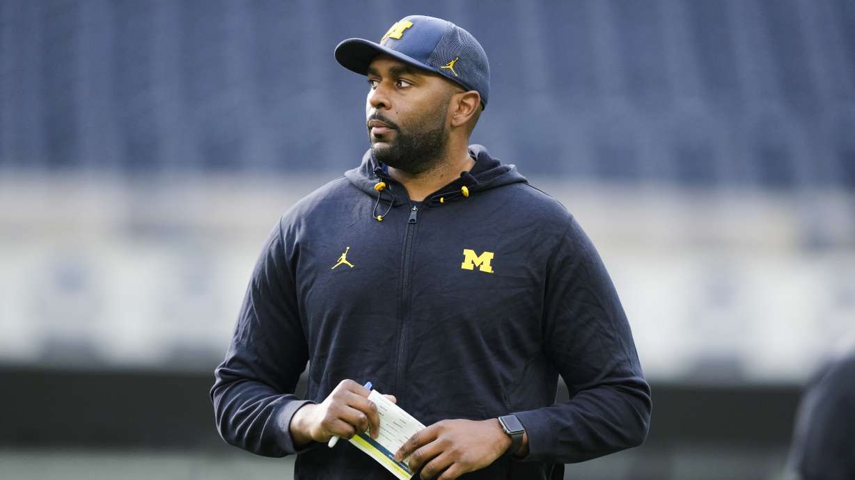 Michigan offensive coordinator Sherrone Moore watches an NCAA college football practice Saturday, Dec. 30, 2023, in Inglewood, Calif. Michigan is scheduled to play against Alabama on New Year's Day in the Rose Bowl, a semifinal in the College Football Playoff.