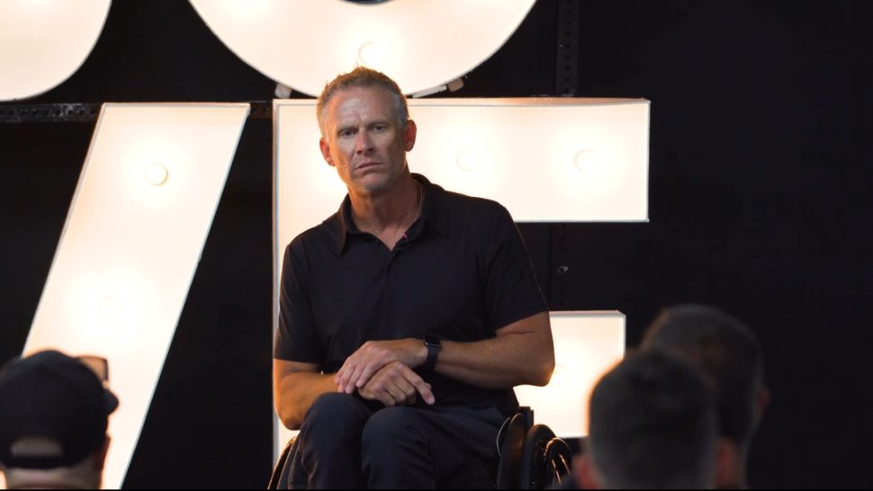 Matt Blanchard tells a crowd about his journey from paralysis to recovery to paralysis again.