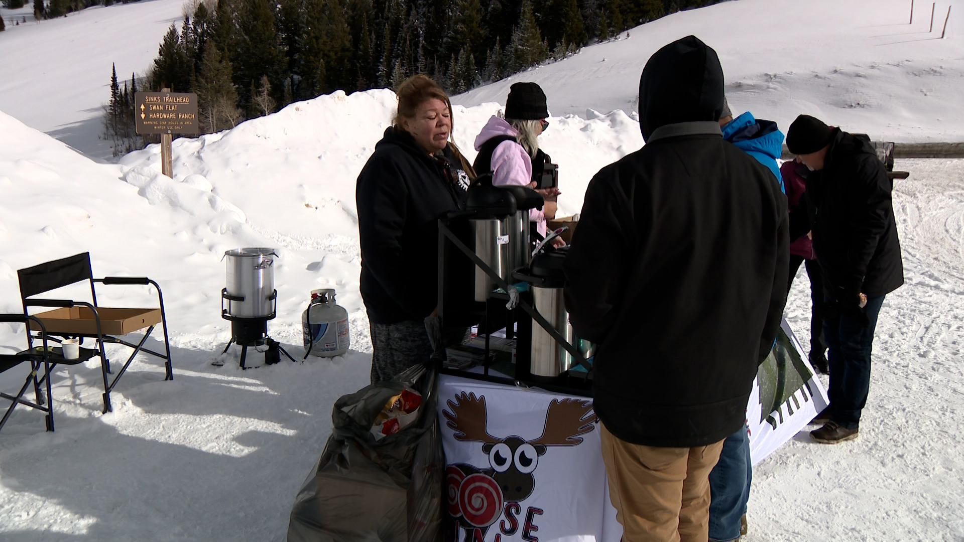 People gather near Moose Buns, a local business in Garden City, Rich County, Friday.
