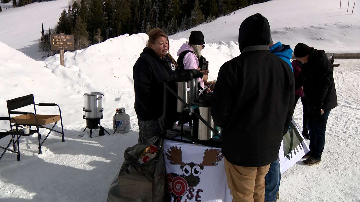 People gather near Moose Buns, a local business in Garden City, Rich County, Friday.