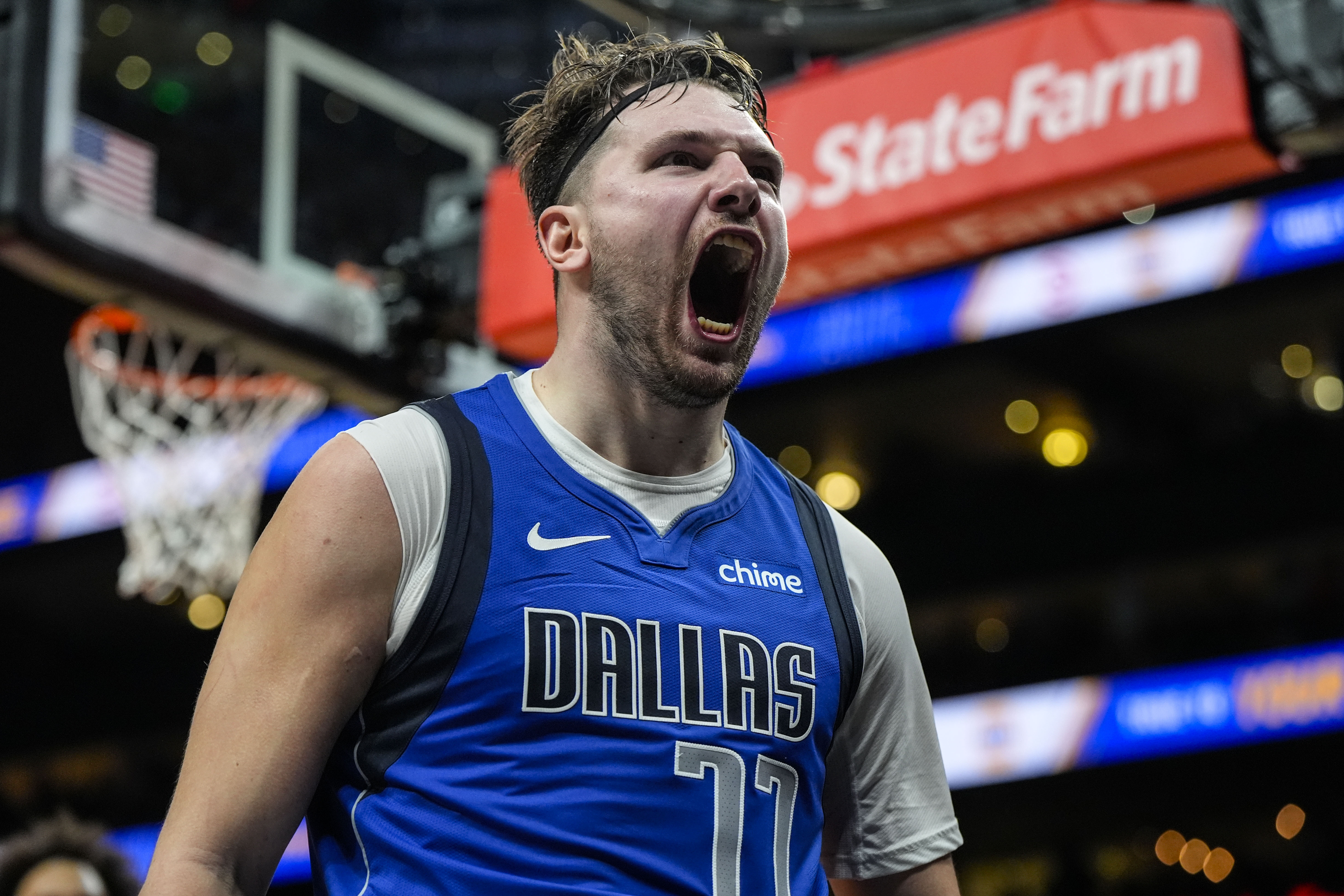 Dallas Mavericks guard Luka Doncic (77) celebrates his shot against the Atlanta Hawks during the second half of an NBA basketball game, Friday, Jan. 26, 2024, in Atlanta. Doncic had 73 points on the night. 