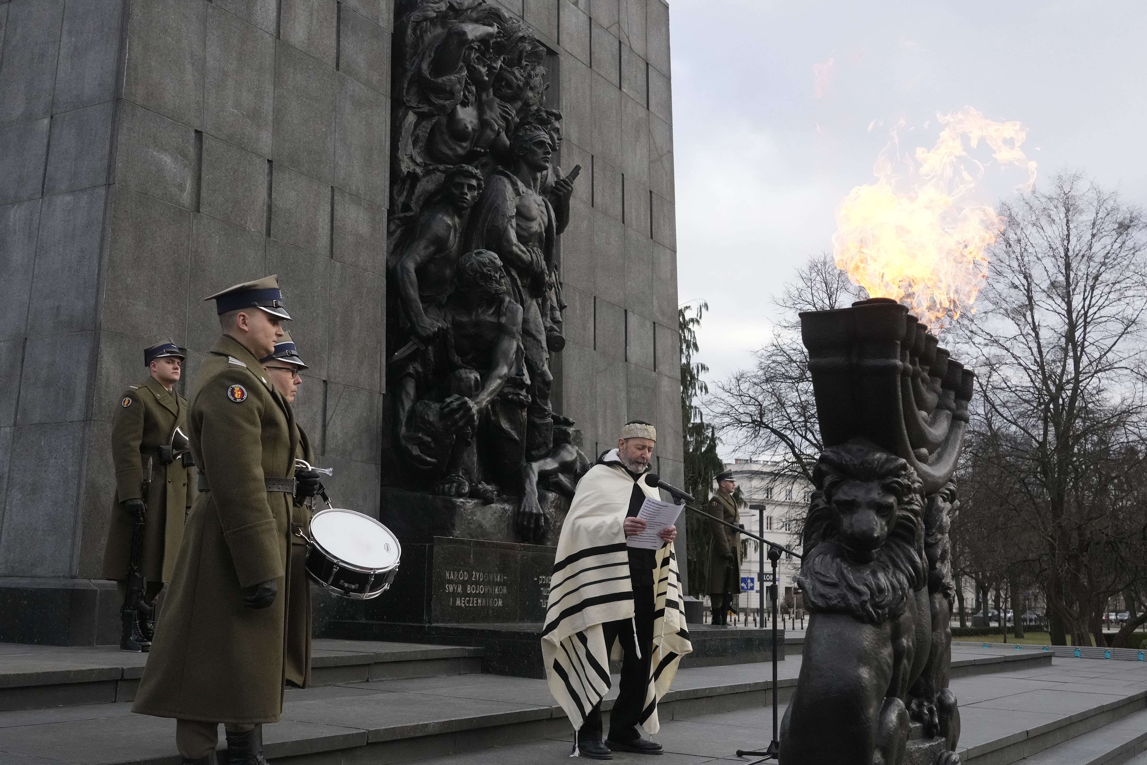 A rabbi say prayers on the eve of the 79th anniversary of the liberation of the Nazi German death camp of Auschwitz-Birkenau by Soviet troops, at the Monument to the Heroes of the Ghetto, in Warsaw, Poland, Friday.