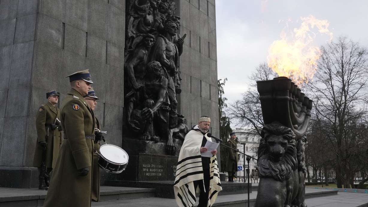 A rabbi say prayers on the eve of the 79th anniversary of the liberation of the Nazi German death camp of Auschwitz-Birkenau by Soviet troops, at the Monument to the Heroes of the Ghetto, in Warsaw, Poland, Friday.