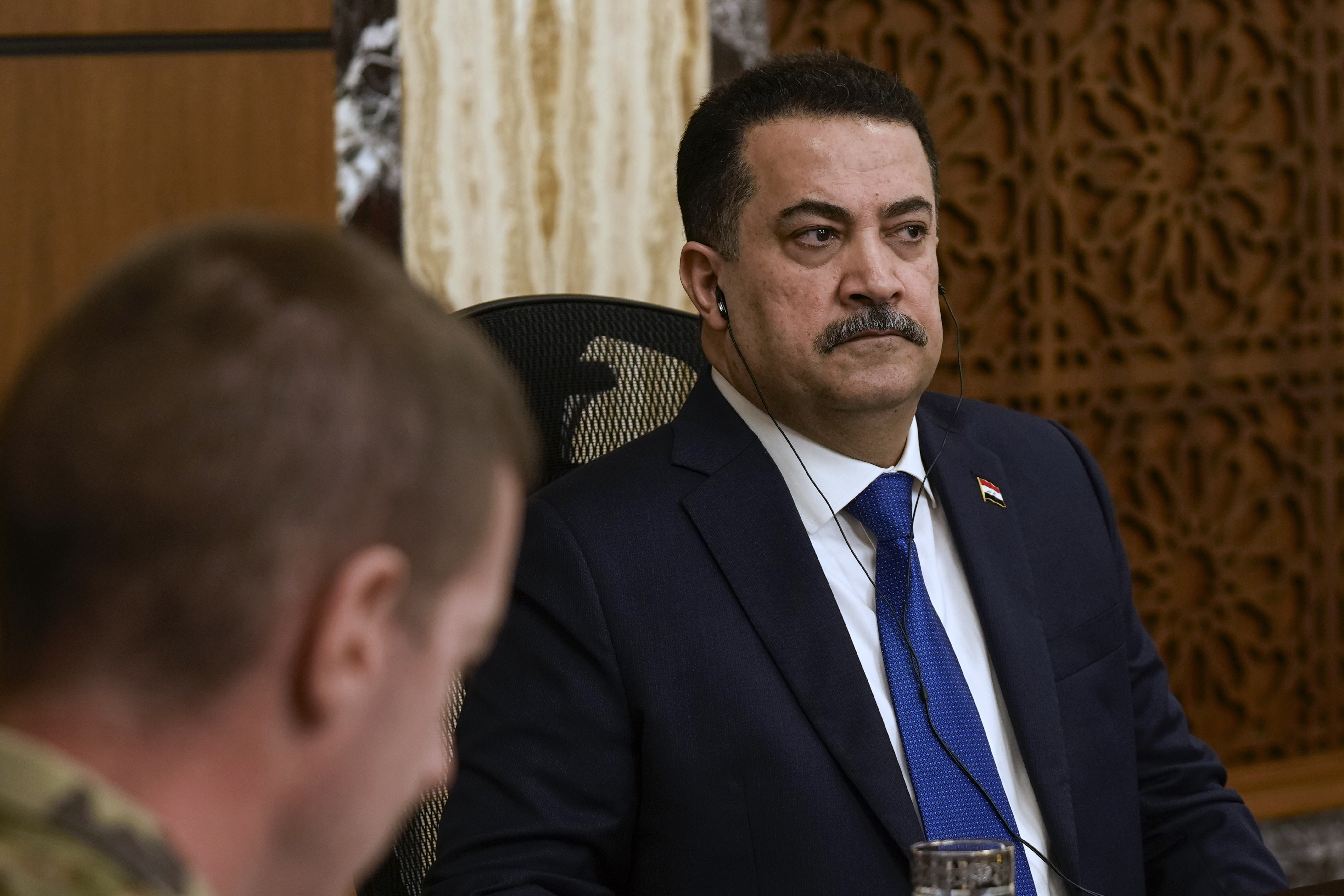 Iraqi Prime Minister Mohammed Shia al-Sudani, right, chairs the first session of negotiations between Iraq and the United States to wind down the International Coalition mission in Baghdad, Iraq, Saturday.