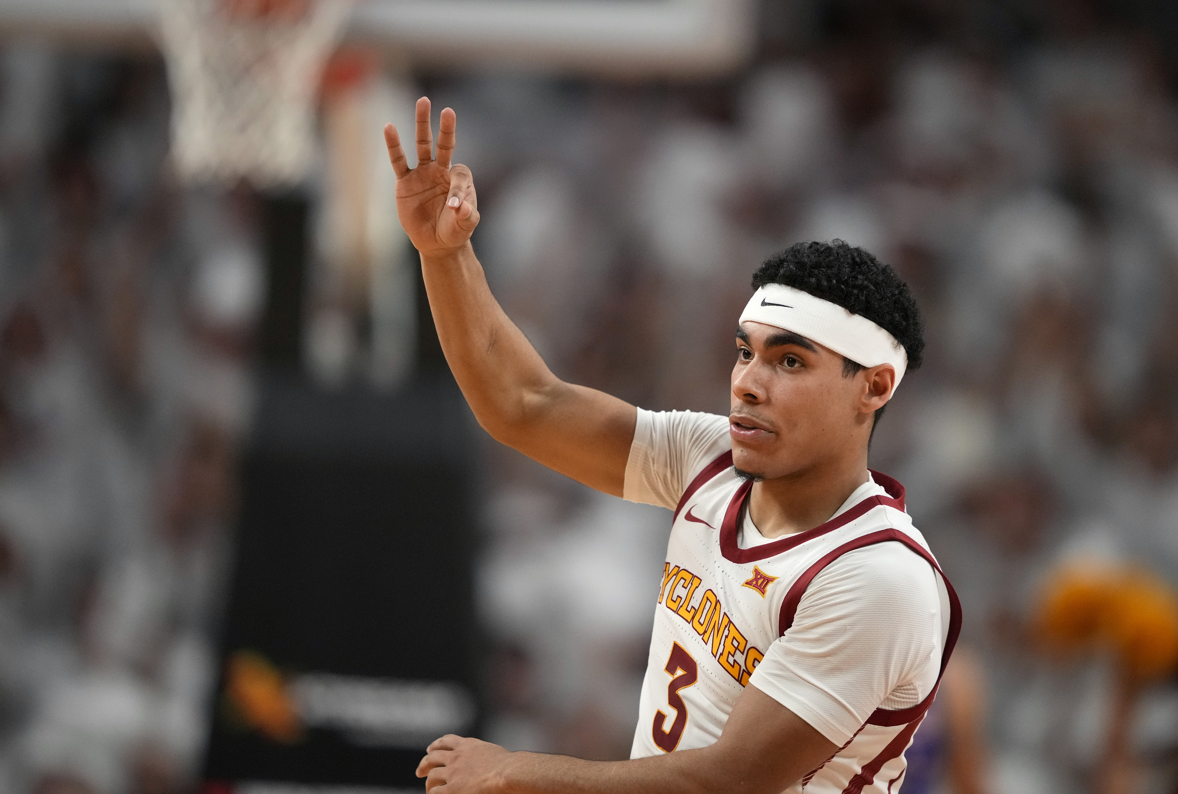 Iowa State guard Tamin Lipsey (3) celebrates a 3-point basket during the first half of an NCAA college basketball game against Kansas, Saturday, Jan. 27, 2024, in Ames, Iowa. 