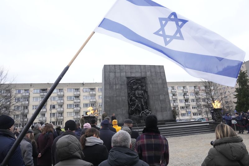 Fire burns in a giant menorah during ceremonies on the eve of the 79th anniversary of the liberation of the Nazi German death camp of Auschwitz-Birkenau by Soviet troops, at the Monument to the Heroes of the Ghetto, in Warsaw, Poland, on Friday. Main ceremonies with the participation of a handful of survivors are to take place at the Auschwitz-Birkenau memorial place on Saturday, which is also the International Holocaust Remembrance Day.