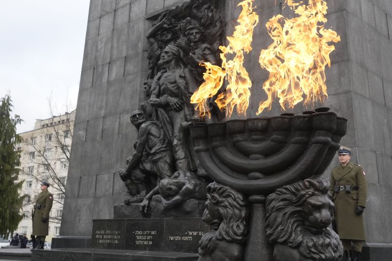 Fire burns in a giant menorah during ceremonies on the eve of the 79th anniversary of the liberation of the Nazi German death camp of Auschwitz-Birkenau by Soviet troops, at the Monument to the Heroes of the Ghetto, in Warsaw, Poland, on Friday. Main ceremonies with the participation of a handful of survivors are to take place at the Auschwitz-Birkenau memorial place on Saturday, which is also the International Holocaust Remembrance Day.