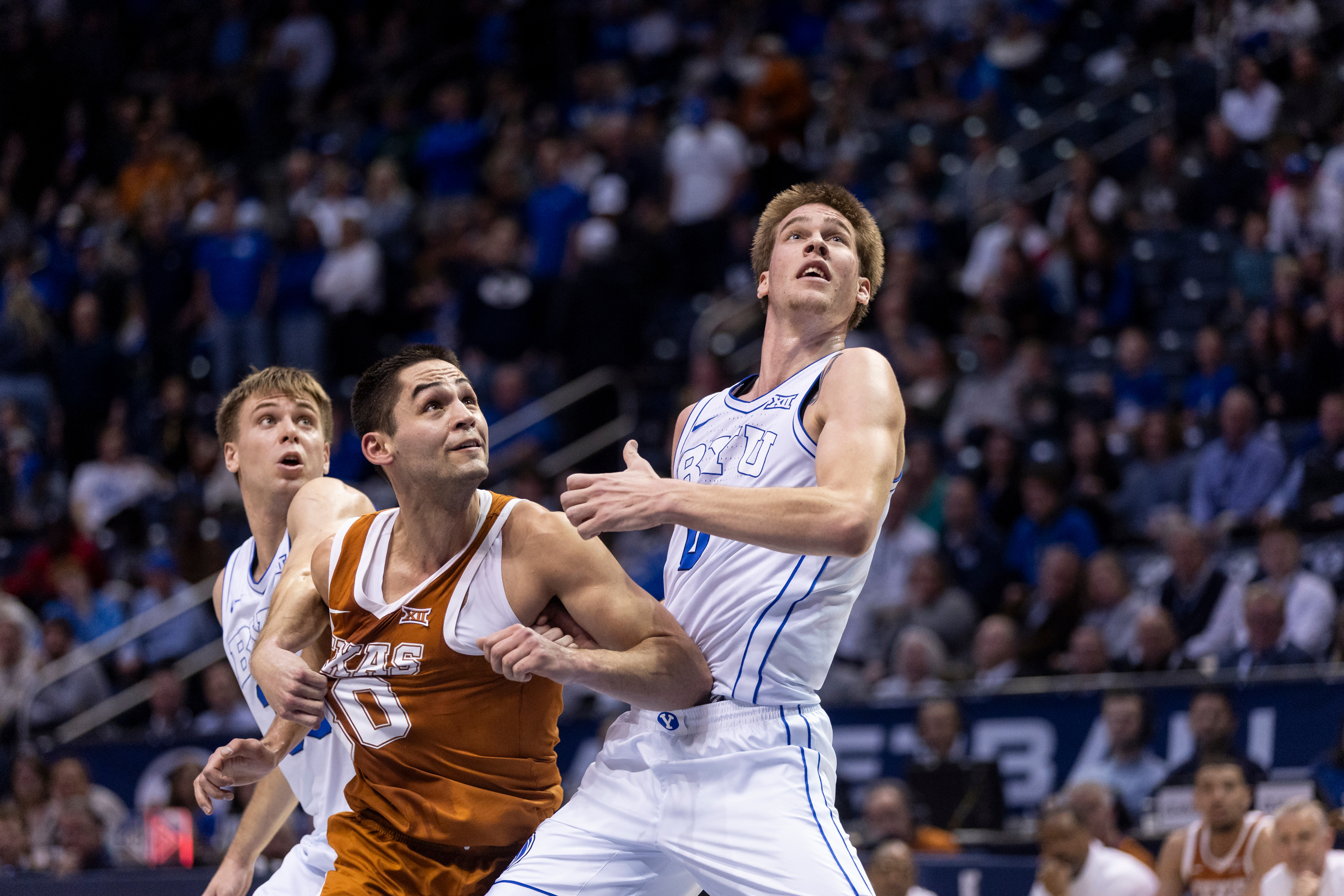 BYU guard Dallin Hall (30), forward Noah Waterman (0) and Texas forward Brock Cunningham (30) watch a foul shot during their game in Provo on Saturday, Jan. 27, 2024.