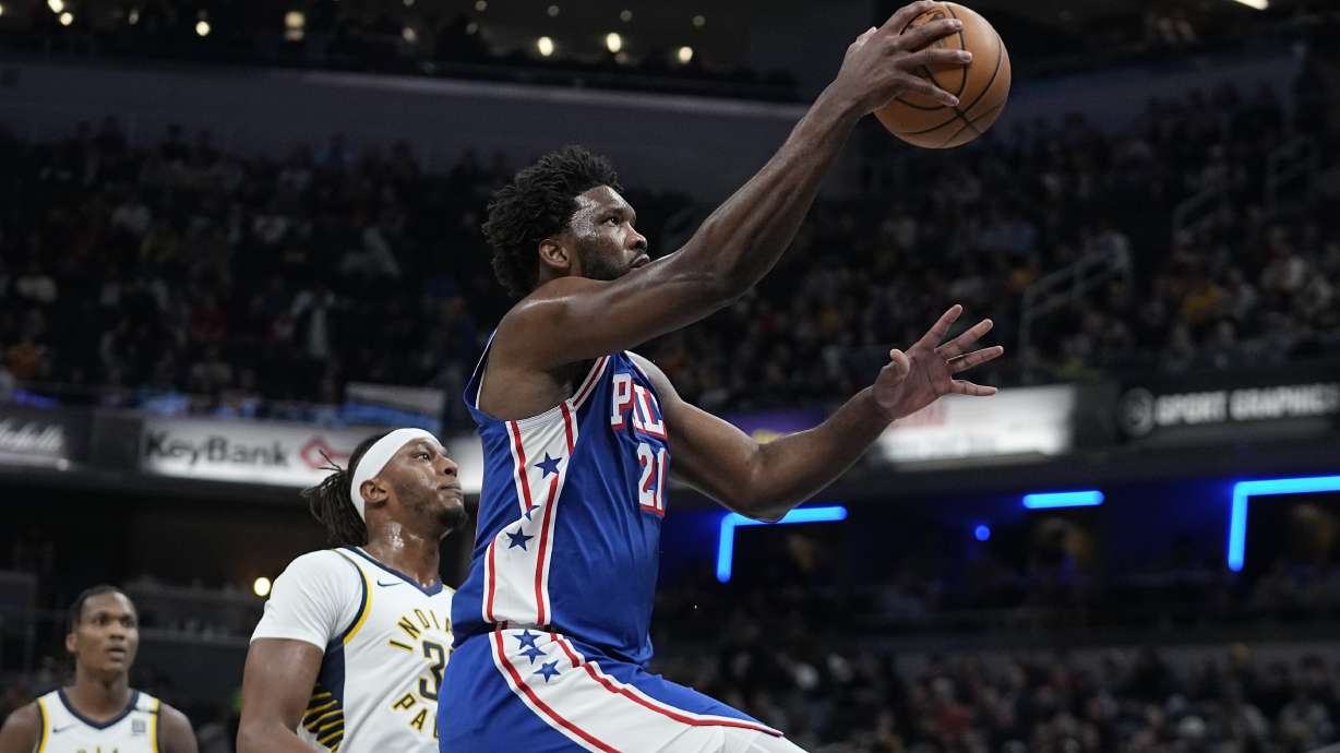 Philadelphia 76ers' Joel Embiid (21) shoots next to Indiana Pacers' Myles Turner (33) during the first half of an NBA basketball game Thursday, Jan. 25, 2024, in Indianapolis.