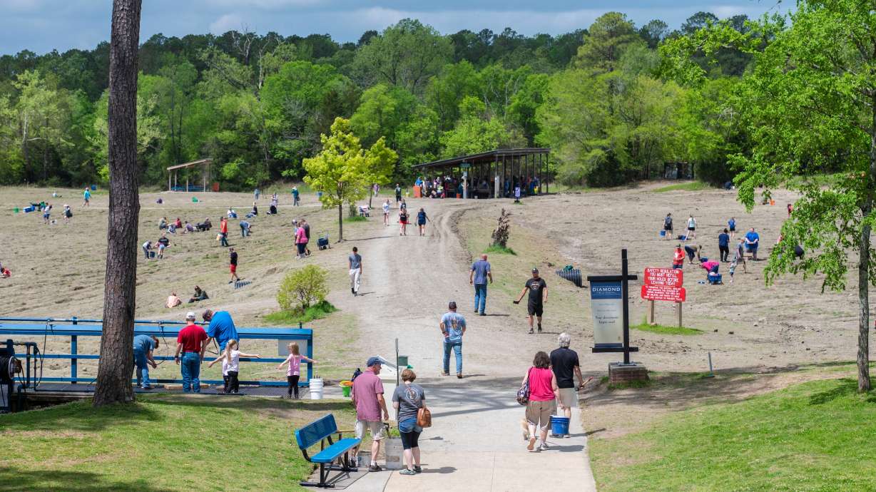 Visitors scour the earth at Crater of Diamonds State Park in Arkansas.