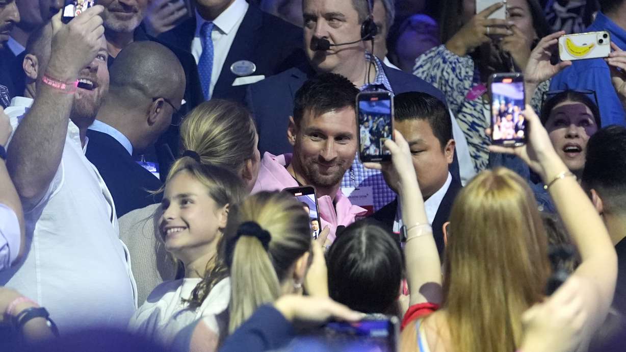 Inter Miami soccer player Lionel Messi walks through the crowd as he arrives for a naming ceremony for Royal Caribbean International's new cruise ship Icon of the Seas, Tuesday, Jan. 23, 2024, in Miami. The cruise line has named Messi as the official icon of the Icon of the Seas ship.