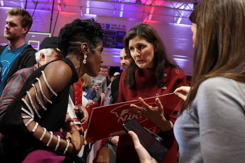 Republican presidential candidate and former U.S. Ambassador to the United Nations Nikki Haley speaks with a supporter in Mauldin, South Carolina, Saturday. She said she does not have to win the nominating contest in South Carolina to stay in the race.