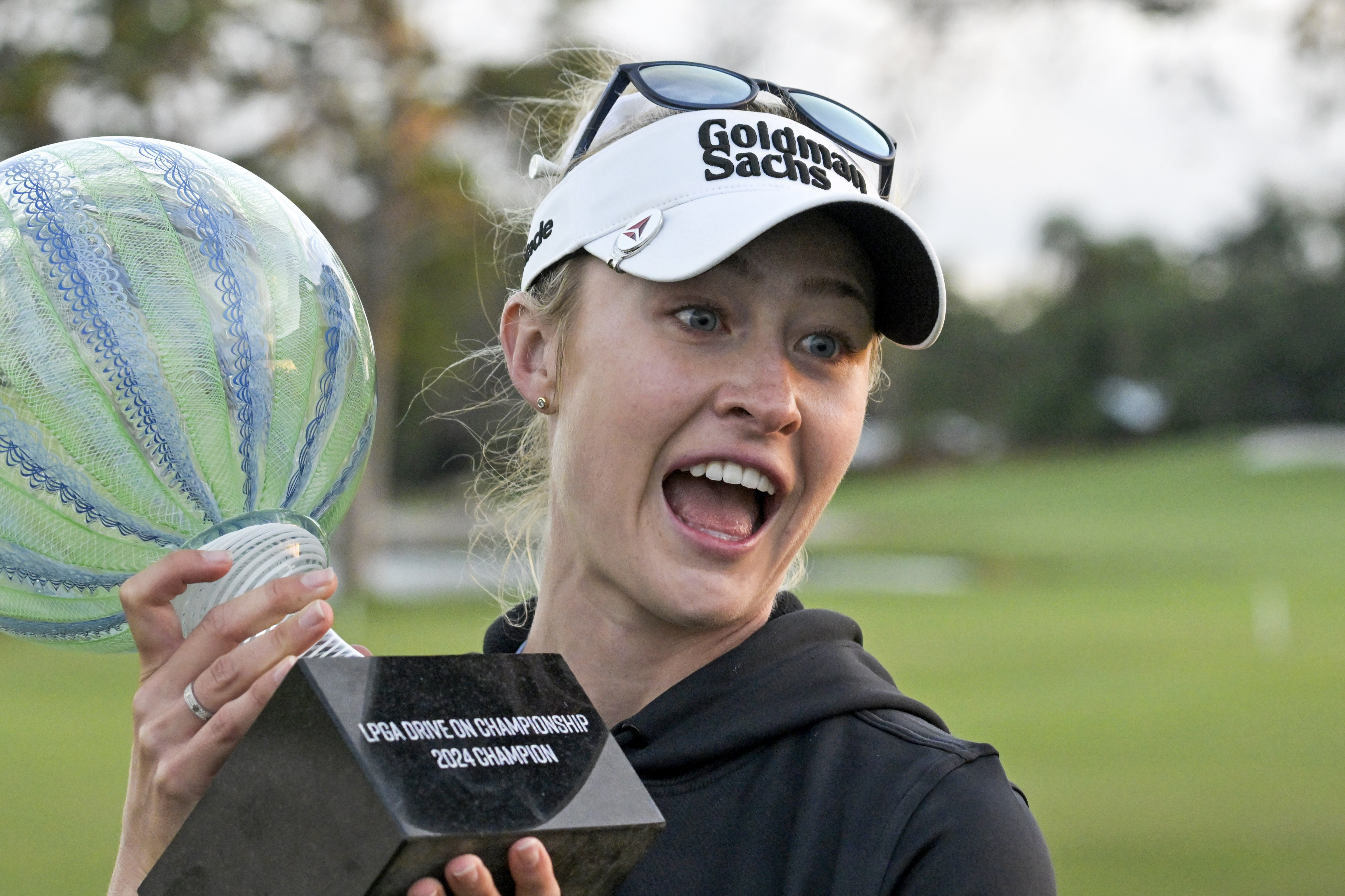 Nelly Korda holds the championship trophy after winning the LPGA Drive On Championship golf tournament at Bradenton Country Club, Sunday, Jan. 28, 2024, in Bradenton, Fla. 