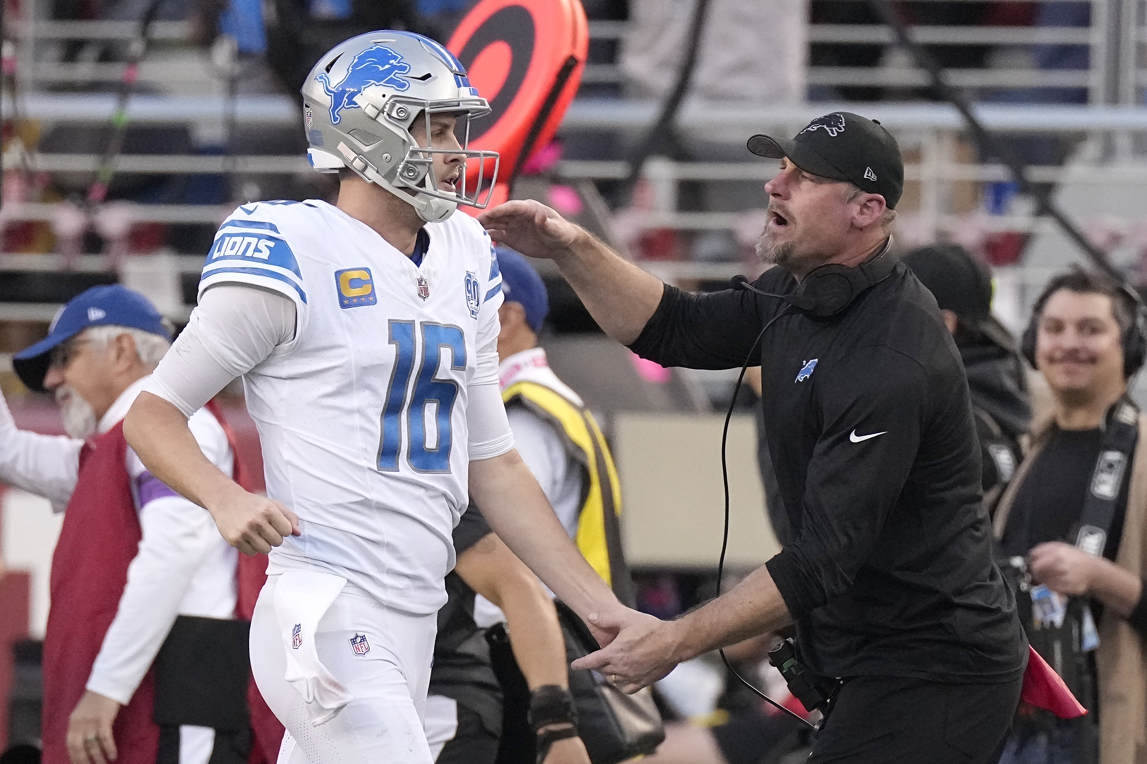Detroit Lions quarterback Jared Goff (16) celebrates with head coach Dan Campbell during the first half of the NFC Championship NFL football game against the San Francisco 49ers in Santa Clara, Calif., Sunday, Jan. 28, 2024.