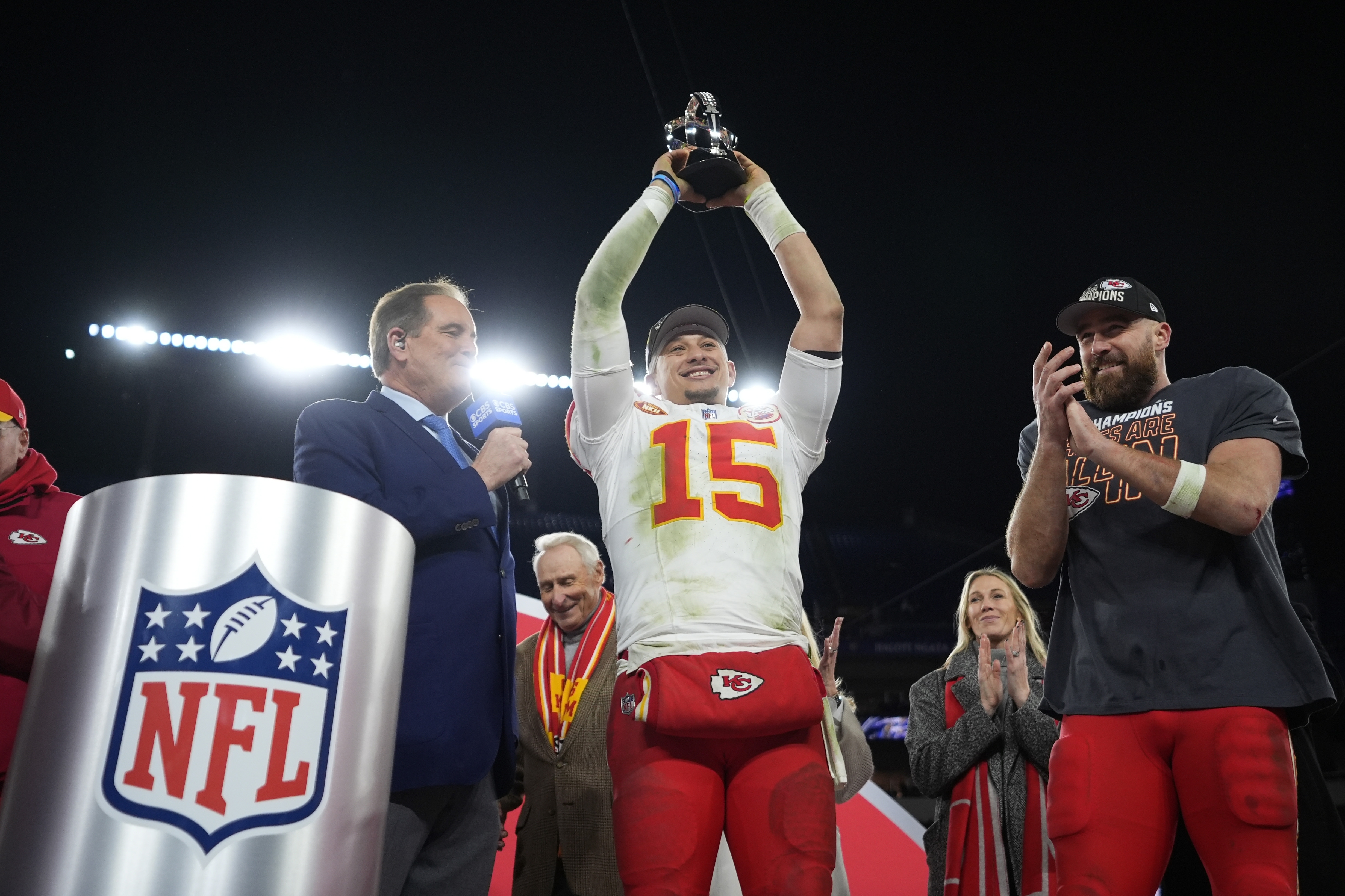 Kansas City Chiefs quarterback Patrick Mahomes (15) holds up the Lamar Hunt Trophy next to Kansas City Chiefs tight end Travis Kelce (87) after the AFC Championship NFL football game against the Baltimore Ravens, Sunday, Jan. 28, 2024, in Baltimore. The Chiefs won 17-10. 