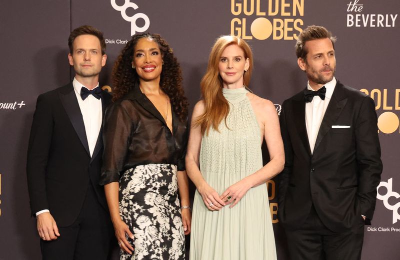From right, Gabriel Macht, Sarah Rafferty, Gina Torres and Patrick J. Adams appear at the 81st Annual Golden Globe Awards in Beverly Hills, Calif., Jan. 7. Legal drama "Suits" took the top spot as the most streamed title ever.