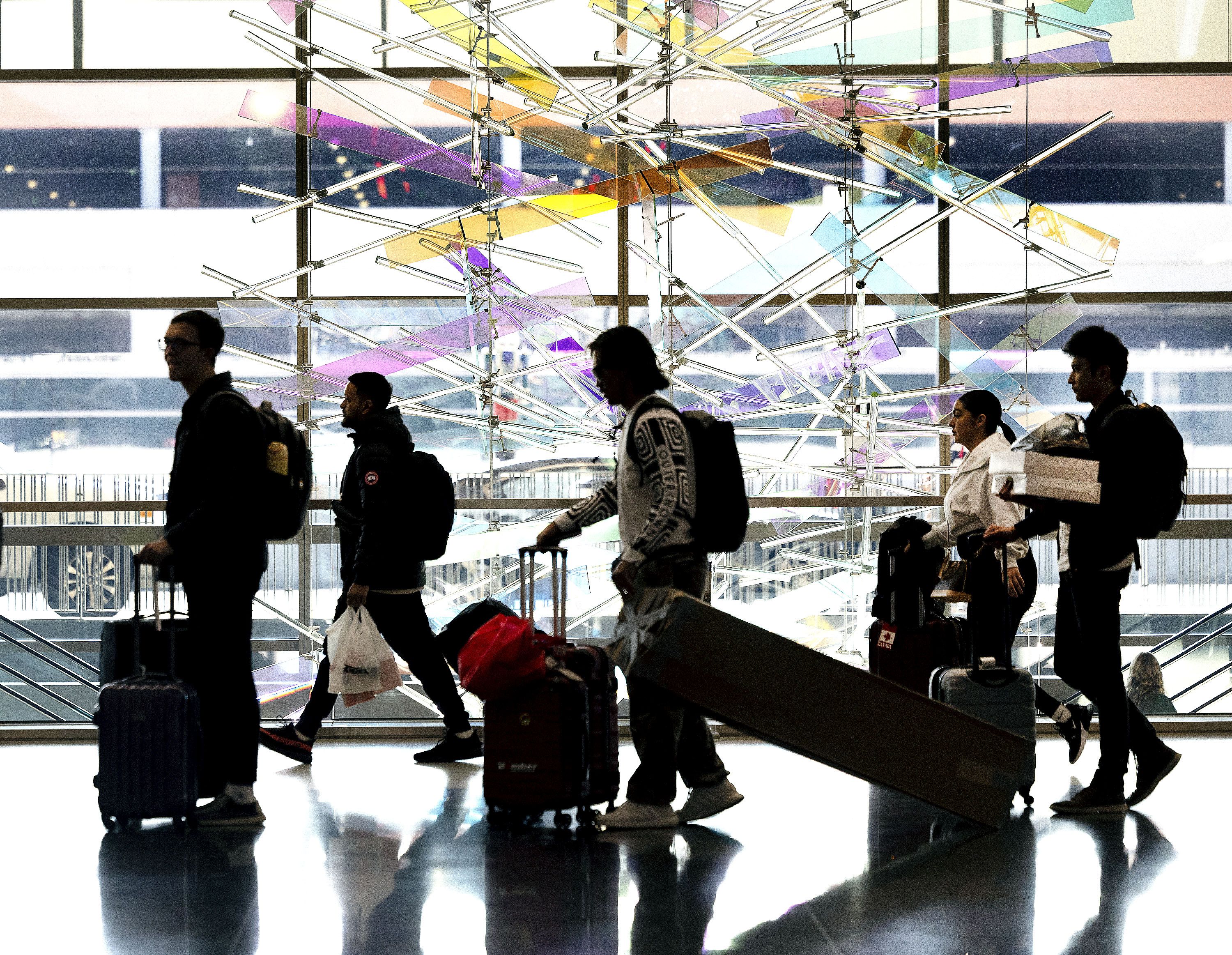 People walk through the Salt Lake City International Airport on Nov. 21, 2023. A record number of passengers made their way through the airport in 2023, according to official numbers.