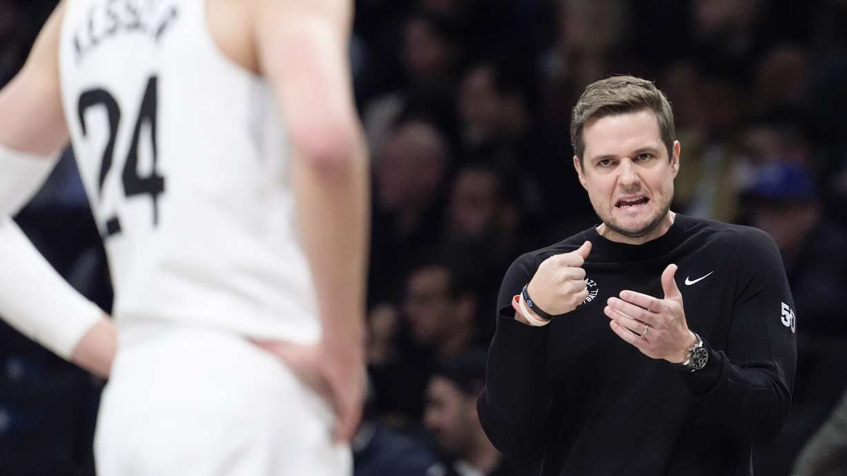 Utah Jazz head coach Will Hardy talks to center Walker Kessler (24) during the first half of an NBA basketball game against the Brooklyn Nets, Monday, Jan. 29, 2024, in New York.