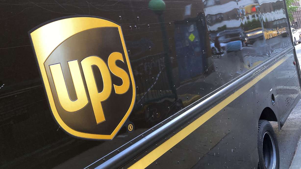 Shares of UPS fell before the market opened on Tuesday as the package delivery company gave a weaker-than-expected full-year revenue forecast and announced it will cut 12,000 jobs.