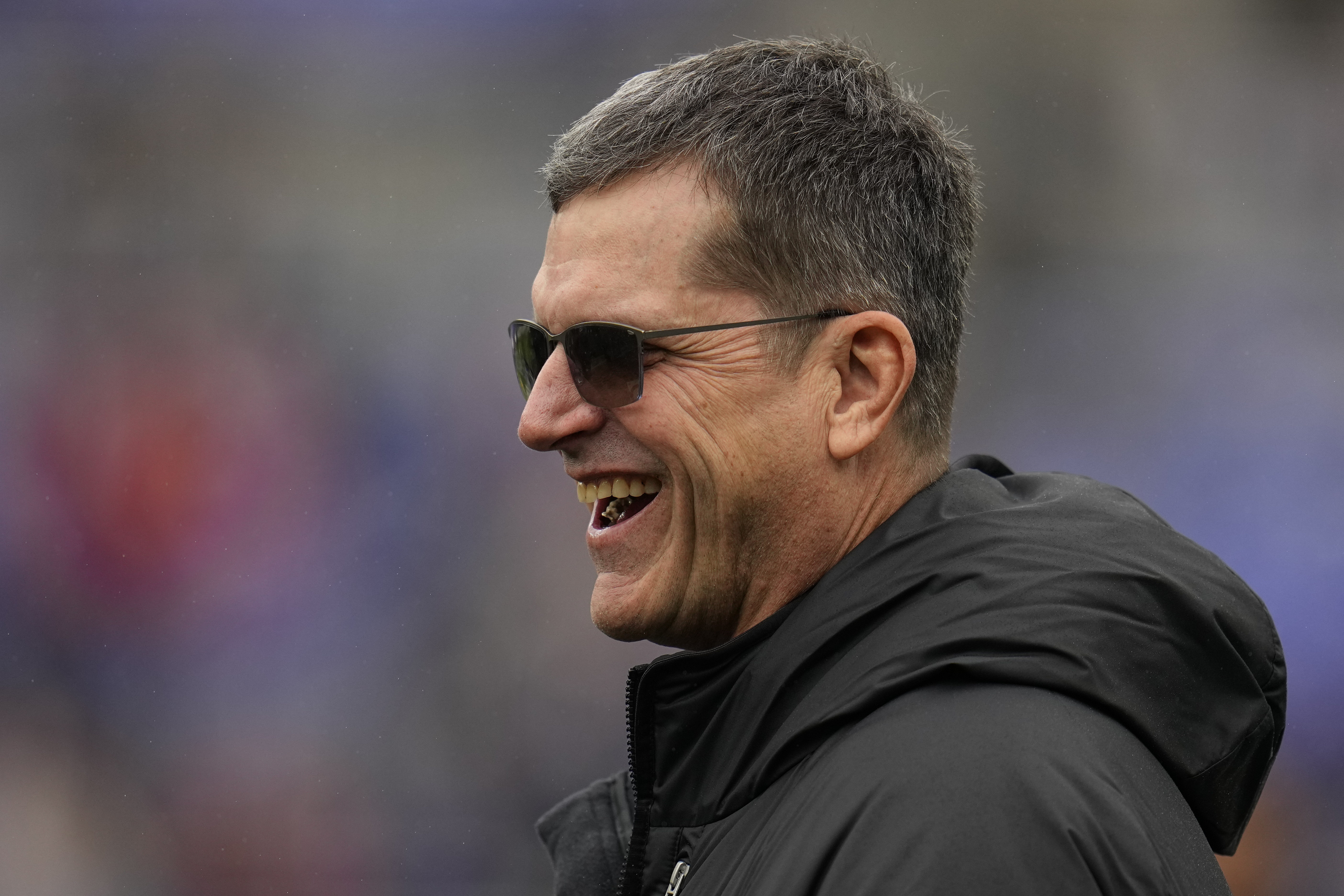 Los Angeles Chargers new head coach Jim Harbaugh walks on the field before an AFC Championship NFL football game between the Baltimore Ravens and the Kansas City Chiefs, Sunday, Jan. 28, 2024, in Baltimore. 