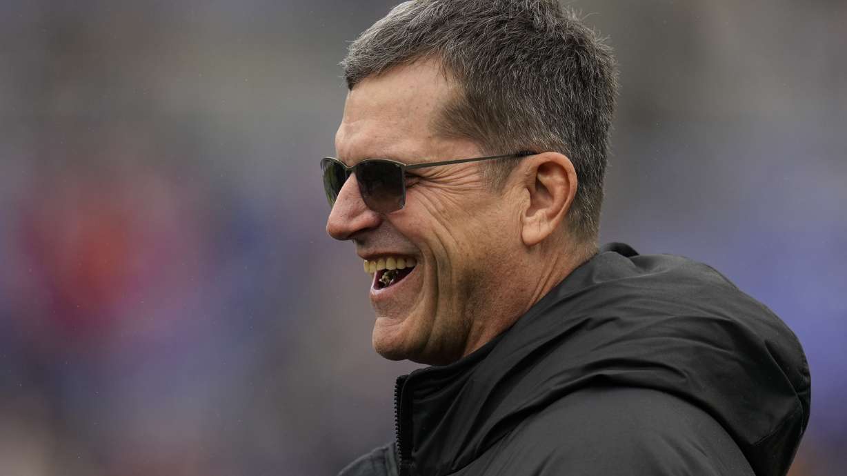 Los Angeles Chargers new head coach Jim Harbaugh walks on the field before an AFC Championship NFL football game between the Baltimore Ravens and the Kansas City Chiefs, Sunday, Jan. 28, 2024, in Baltimore.