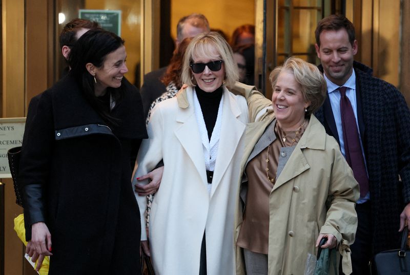 E. Jean Carroll, center, and her attorneys walk outside the Manhattan Federal Court in New York City, Jan. 26. Donald Trump on Friday appealed Carroll's $83.3 million verdict in her recent defamation case.