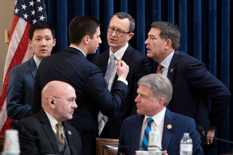 Chairman Rep. Mark Green, R-Tenn., speaks with staff during a House Homeland Security Committee meeting to vote on impeachment charges against Department of Homeland Security Secretary Alejandro Mayorkas on Capitol Hill in Washington, Tuesday.