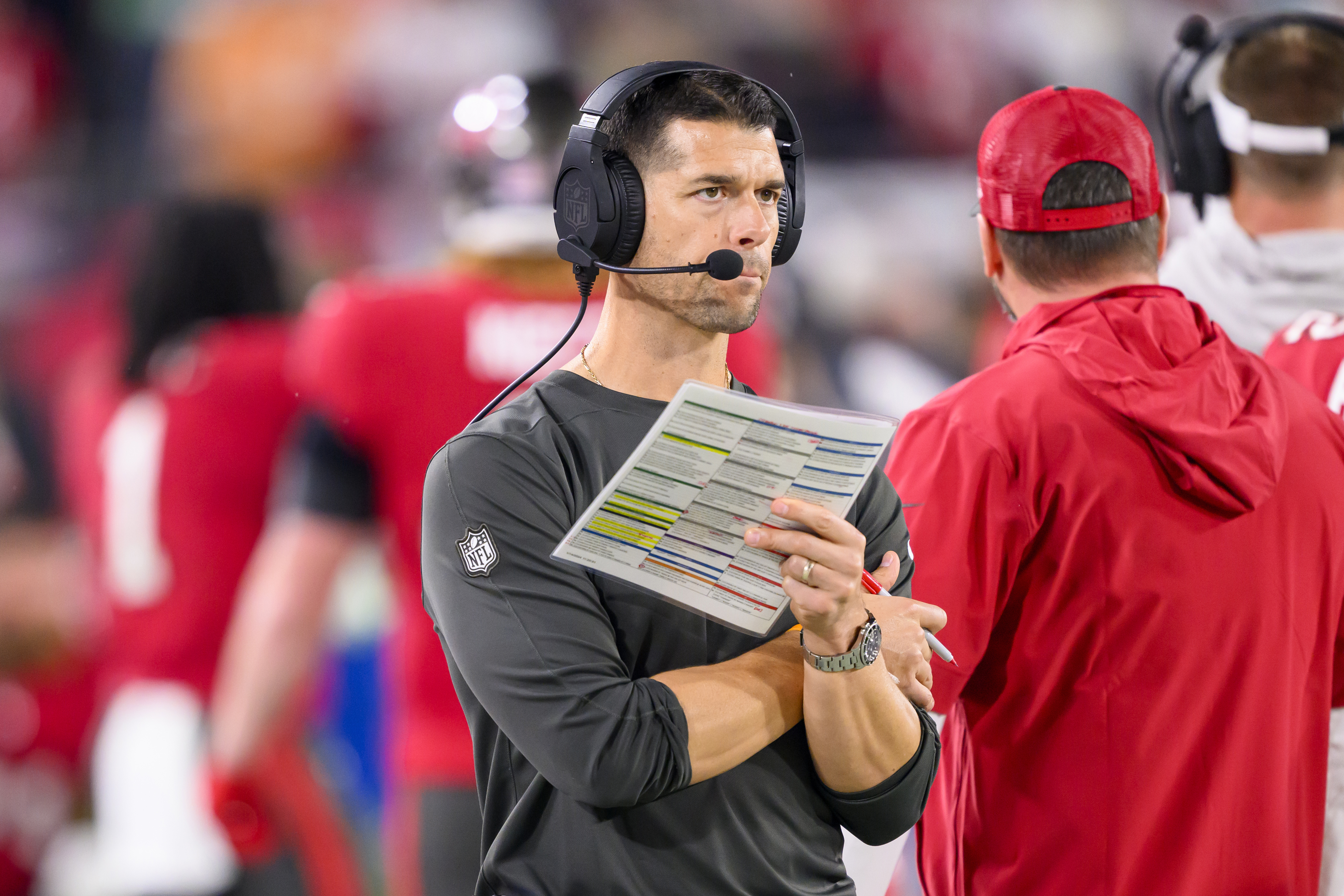 FILE - Tampa Bay Buccaneers offensive coordinator Dave Canales holds the play sheet on the sidelines during an NFL wild-card playoff football game against the Philadelphia Eagles, Monday, Jan. 15, 2024 in Tampa, Fla. The Carolina Panthers have agreed to hire Tampa Bay Buccaneers offensive coordinator Dave Canales as their new head coach, according to two people familiar with the situation.