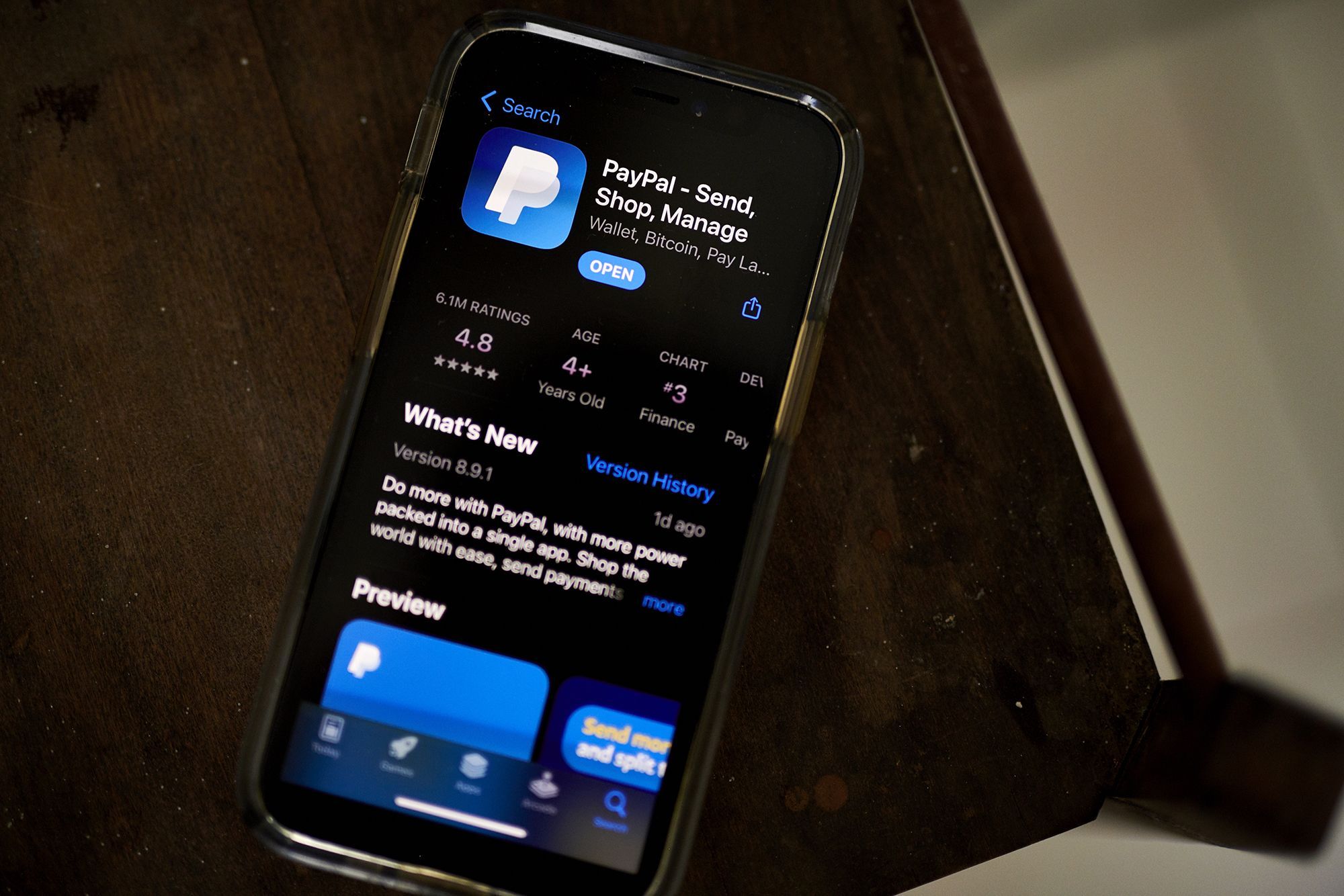The PayPal application, seen here in the Apple App Store on a smartphone, is laying off 2,000 employees.
