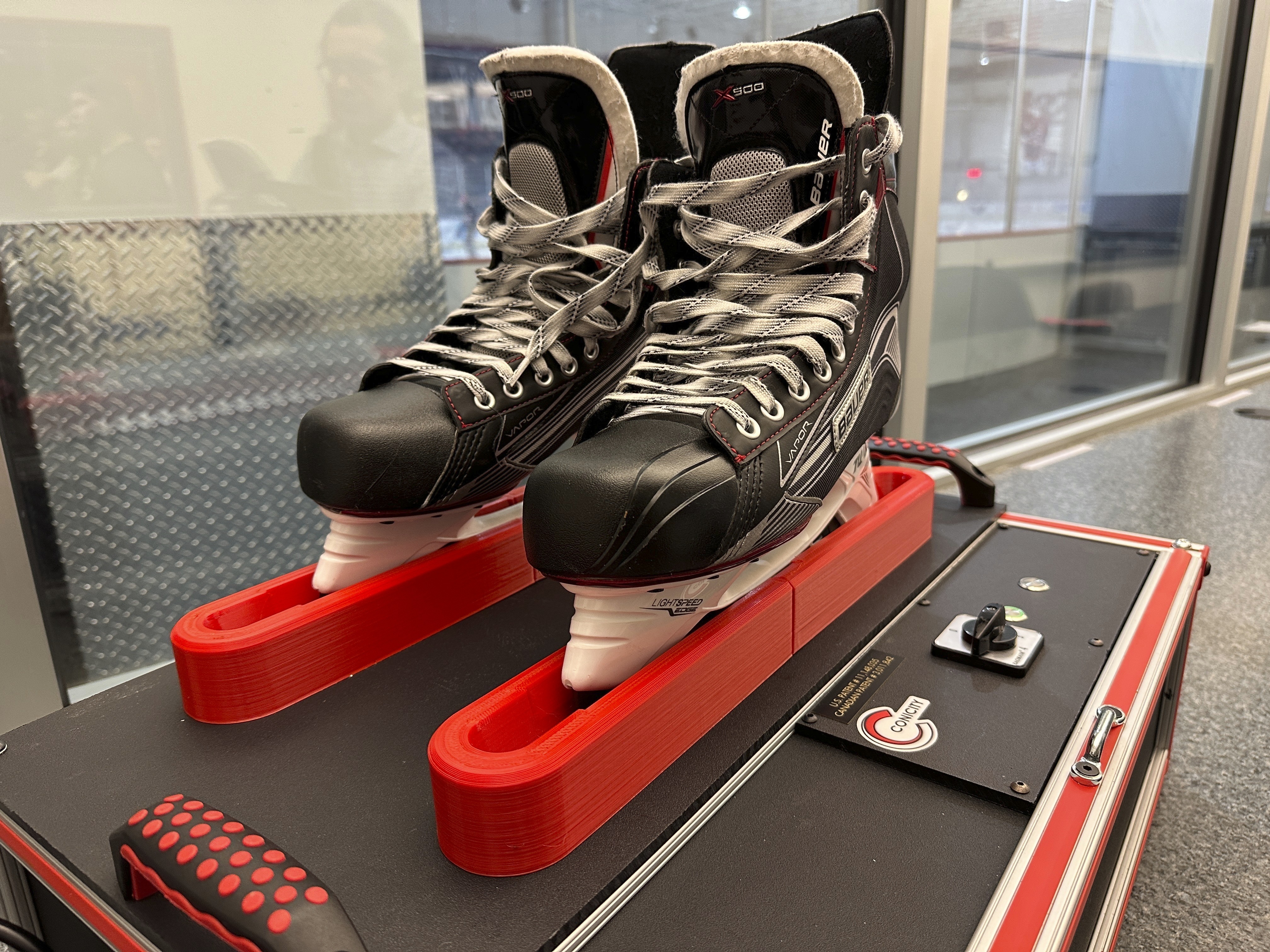 Skates sit in a Conicity Technologies’ grinding machine designed to remove tiny burrs from the metal blades, at the Washington Capitals NHL hockey team practice facility in Arlington, Virginia, Nov. 28, 2023. Dr. Bill Shaffer and son Luke, who come from a metal-cutting background, designed and built the machine they say can dramatically reduce the cutting qualities of skate blades while also keeping them sharp and allowing for better gliding along ice. The death of American hockey player Adam Johnson from a skate cut to the neck during a game in England has led to plenty of talk about how to prevent such injuries in the fast-paced sport, including a new neck laceration protection mandate in the U.S.