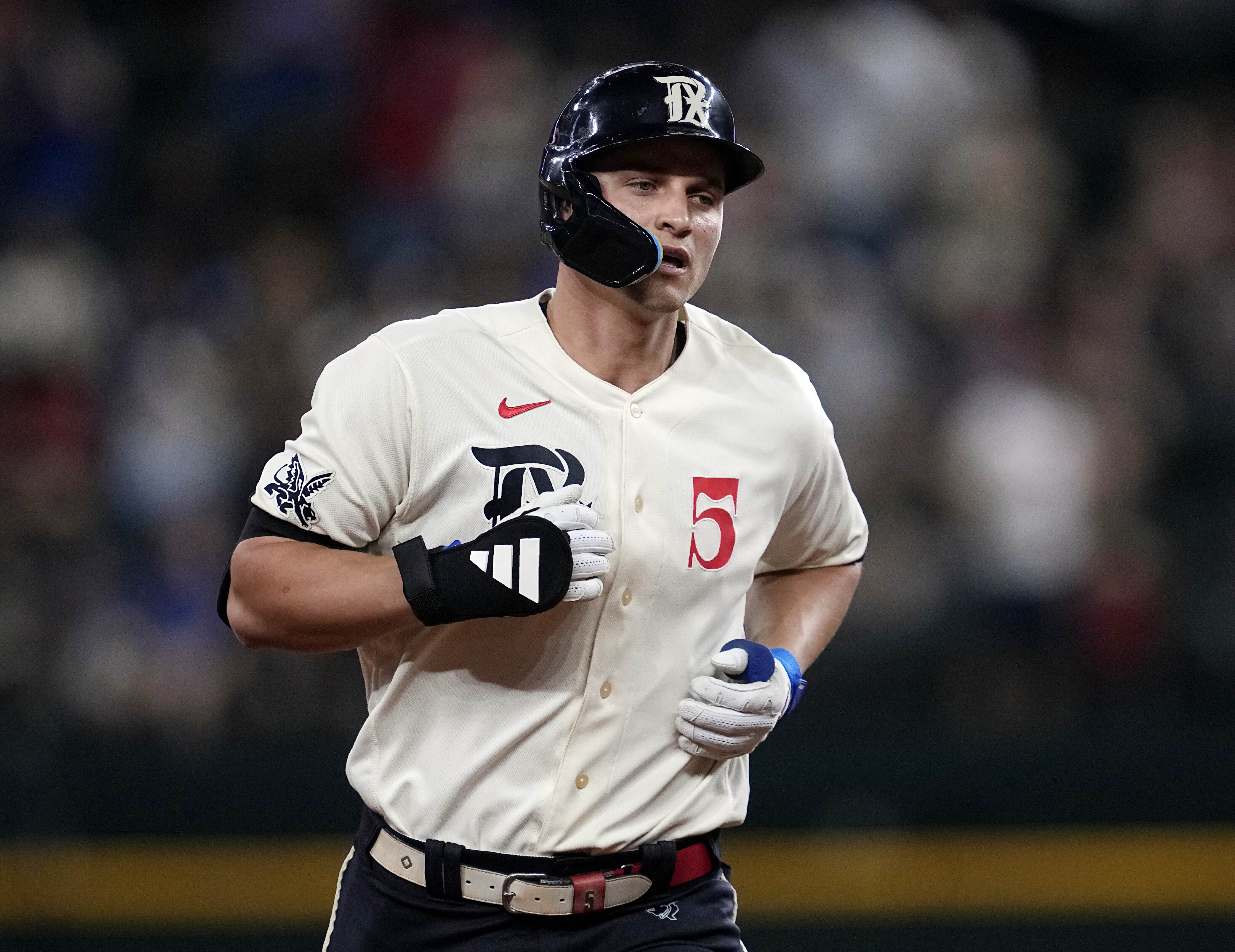 FILE -Texas Rangers' Corey Seager rounds the bases after hitting a solo home run during a baseball game against the Minnesota Twins, Friday, Sept. 1, 2023, in Arlington, Texas. World Series MVP Corey Seager had surgery Tuesday, Jan. 30, 2024 for a left sports hernia repair and the Texas Rangers All-Star shortstop will miss most of spring training.