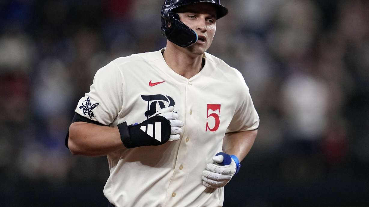 FILE -Texas Rangers' Corey Seager rounds the bases after hitting a solo home run during a baseball game against the Minnesota Twins, Friday, Sept. 1, 2023, in Arlington, Texas. World Series MVP Corey Seager had surgery Tuesday, Jan. 30, 2024 for a left sports hernia repair and the Texas Rangers All-Star shortstop will miss most of spring training.